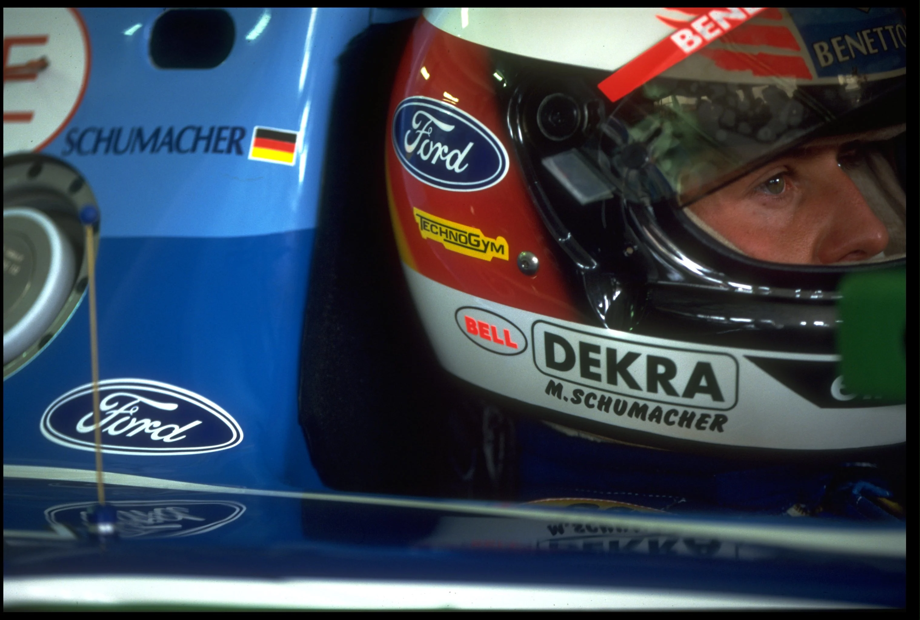 31 JUL 1994: MICHAEL SCHUMACHER OF GERMANY SITS IN HIS BENETTON FORD IN THE PITS BEFORE THE GERMAN