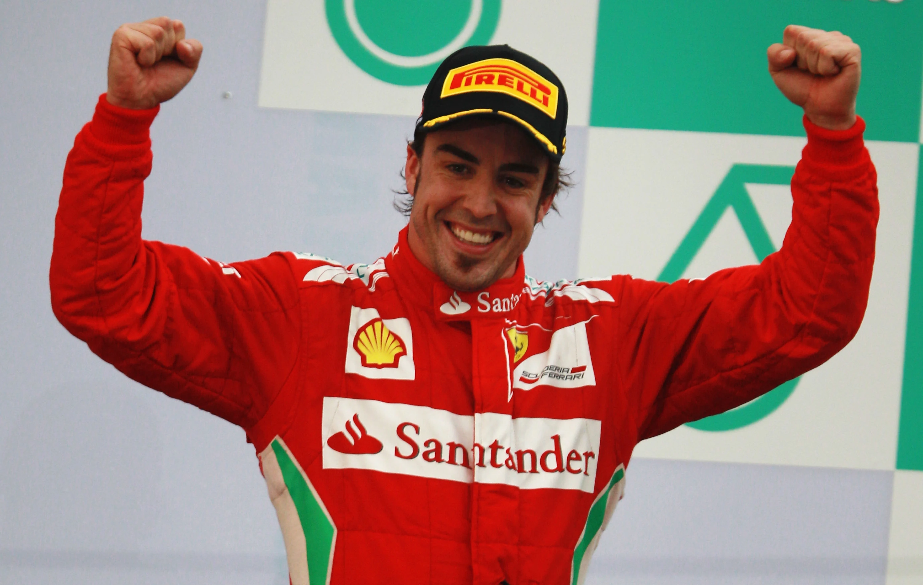 KUALA LUMPUR, MALAYSIA - MARCH 25: Fernando Alonso of Spain and Ferrari celebrates on the podium