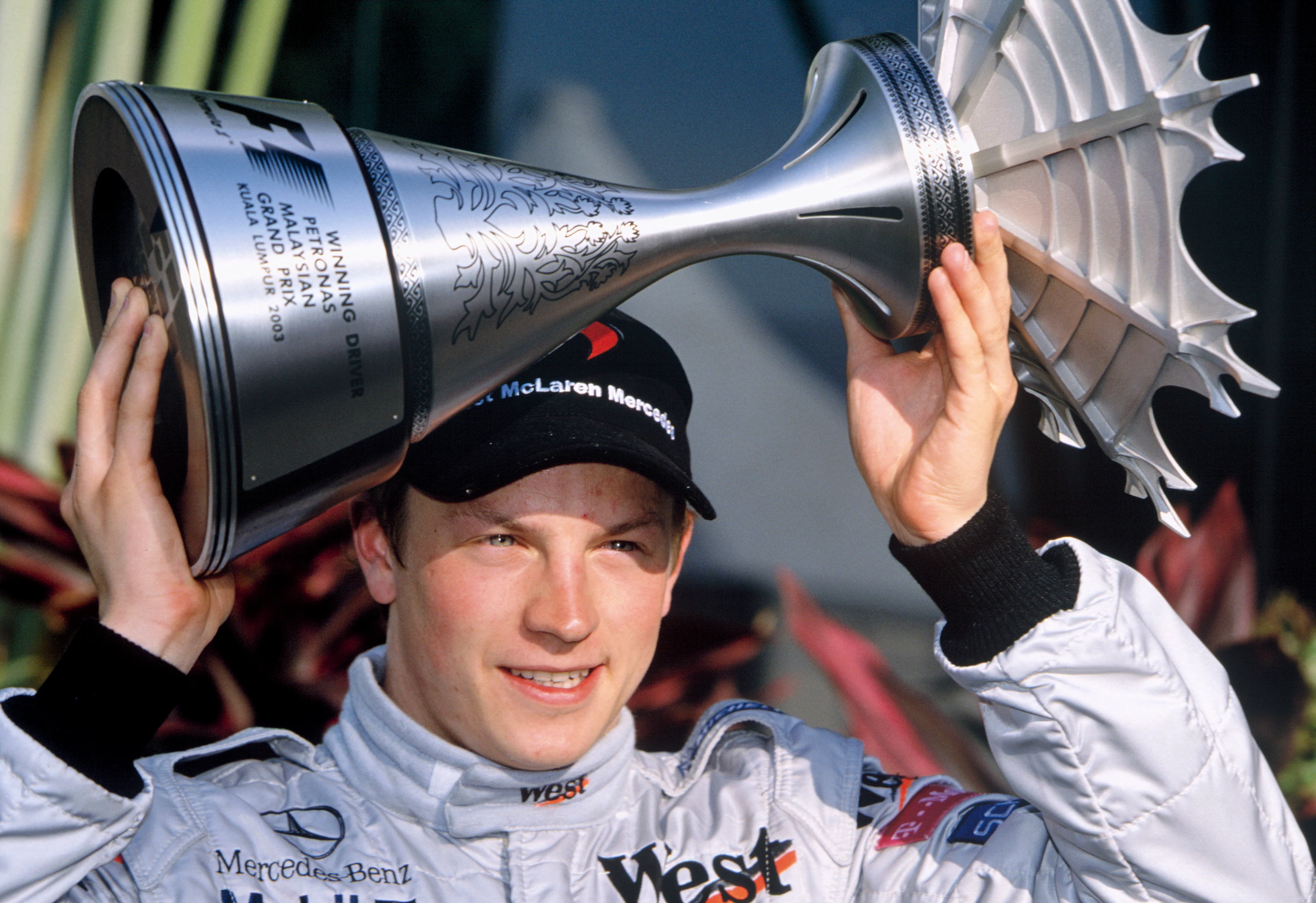 2003 Malaysian Grand Prix Sepang, Malaysia. 21st - 23rd March 2003. Race winner Kimi Raikkonen,