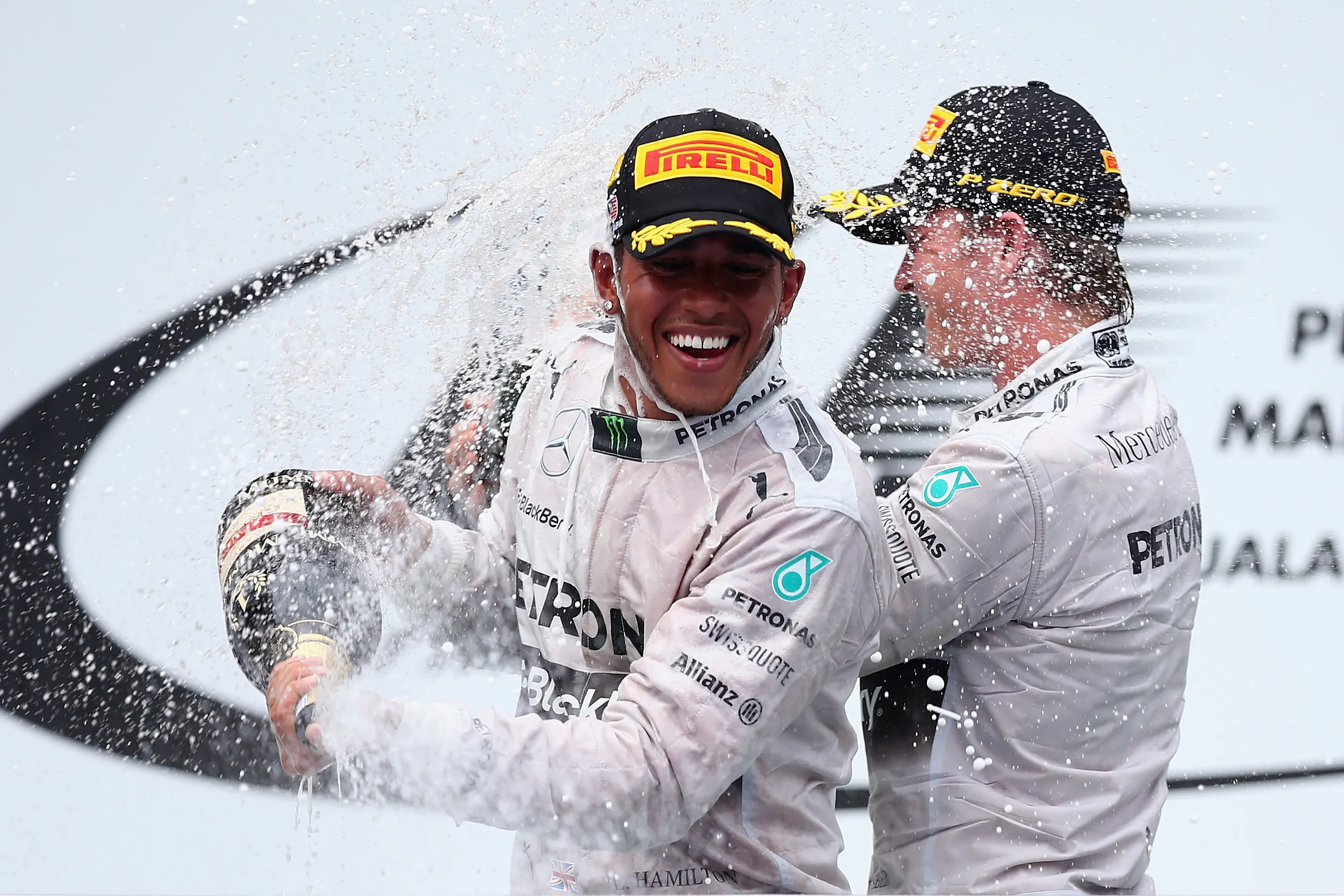 KUALA LUMPUR, MALAYSIA - MARCH 30: Race winner Lewis Hamilton of Great Britain and Mercedes GP (L)