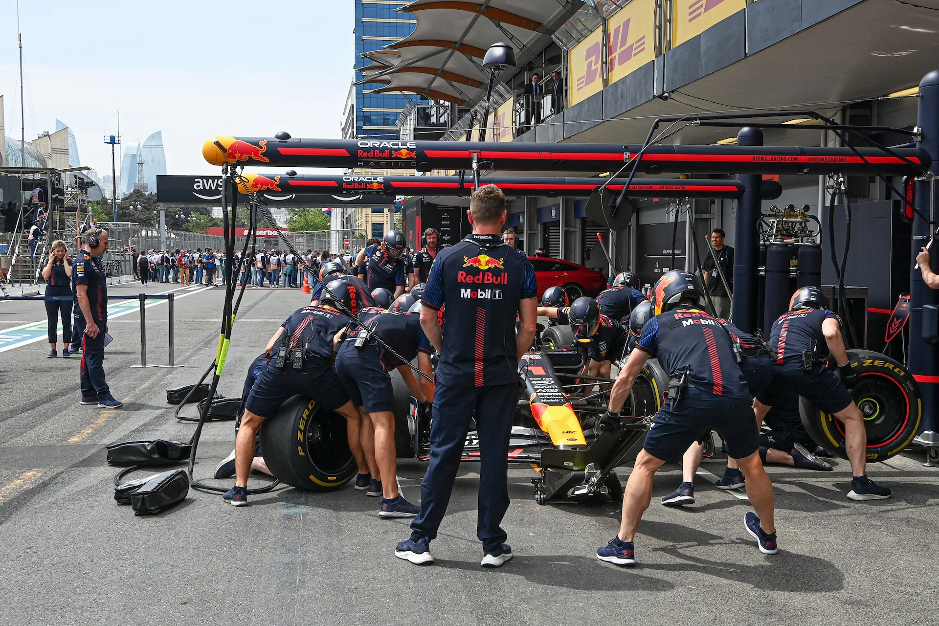 BAKU CITY CIRCUIT, AZERBAIJAN - APRIL 30: Red Bull mechanics in the pit lane with the car of Max