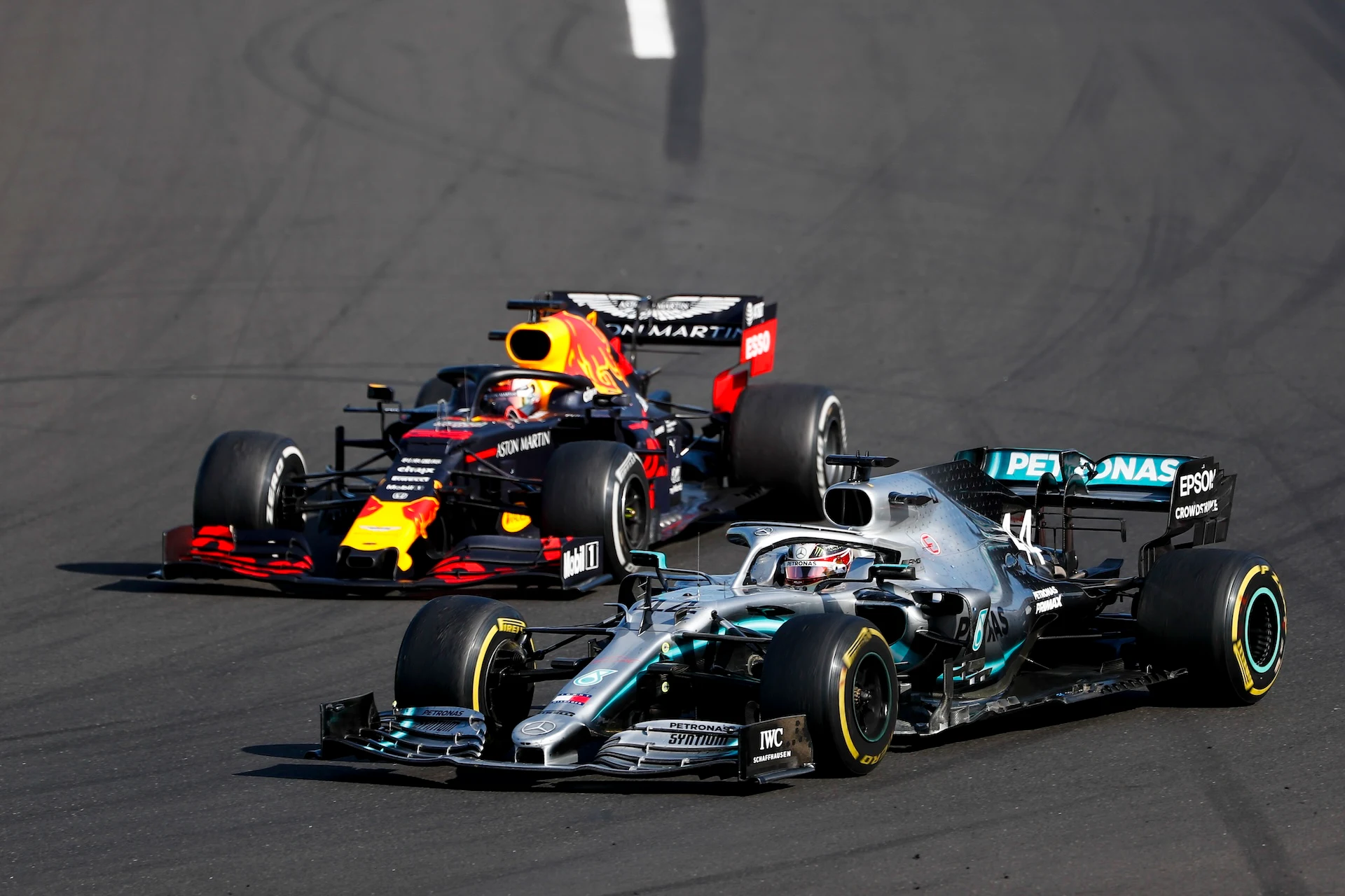 HUNGARORING, HUNGARY - AUGUST 04: Lewis Hamilton, Mercedes AMG F1 W10 overtakes Max Verstappen, Red