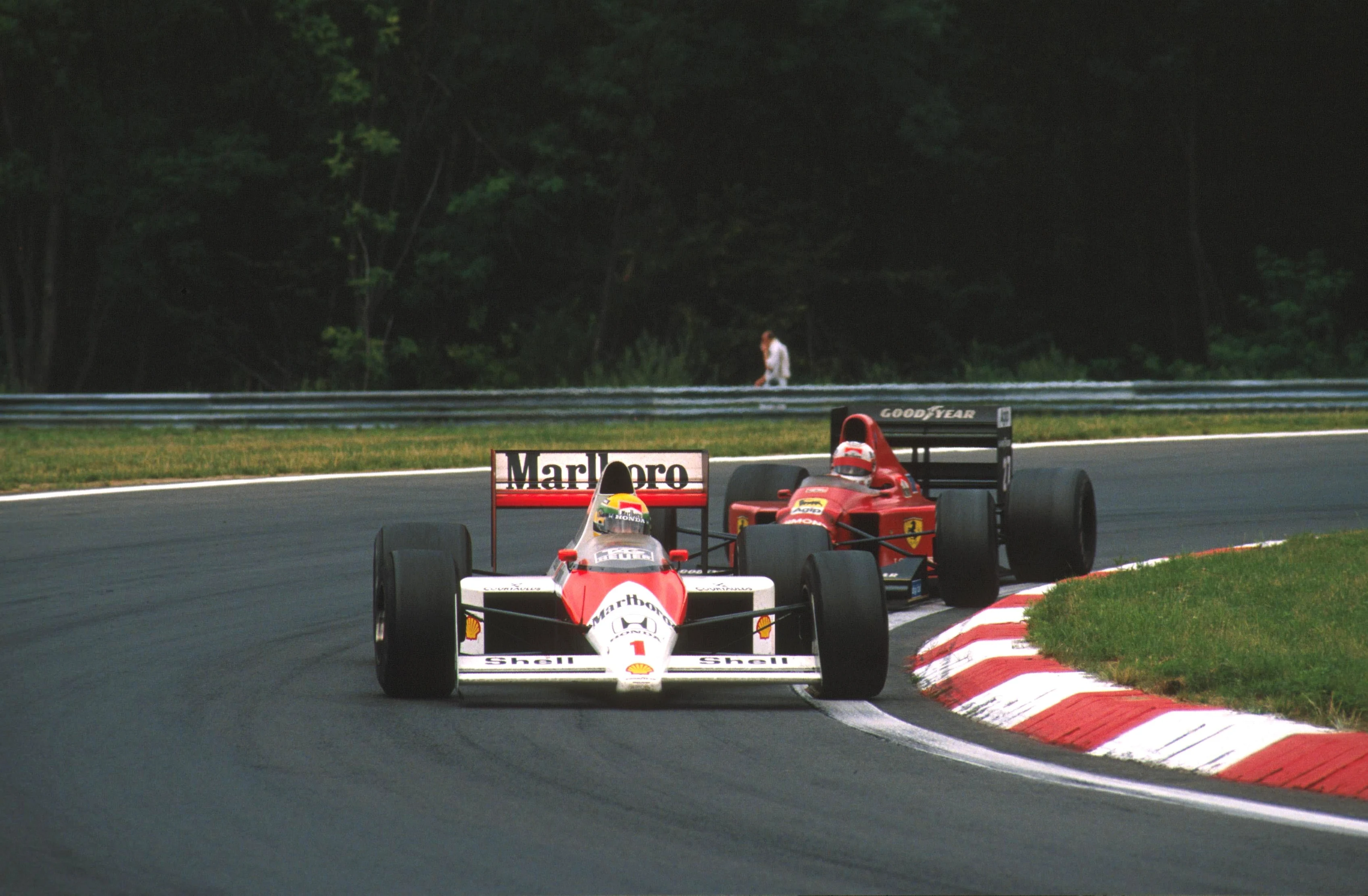 HUNGARORING, HUNGARY - AUGUST 13: Ayrton Senna (BRA). McLaren MP4/5 leads race winner Nigel