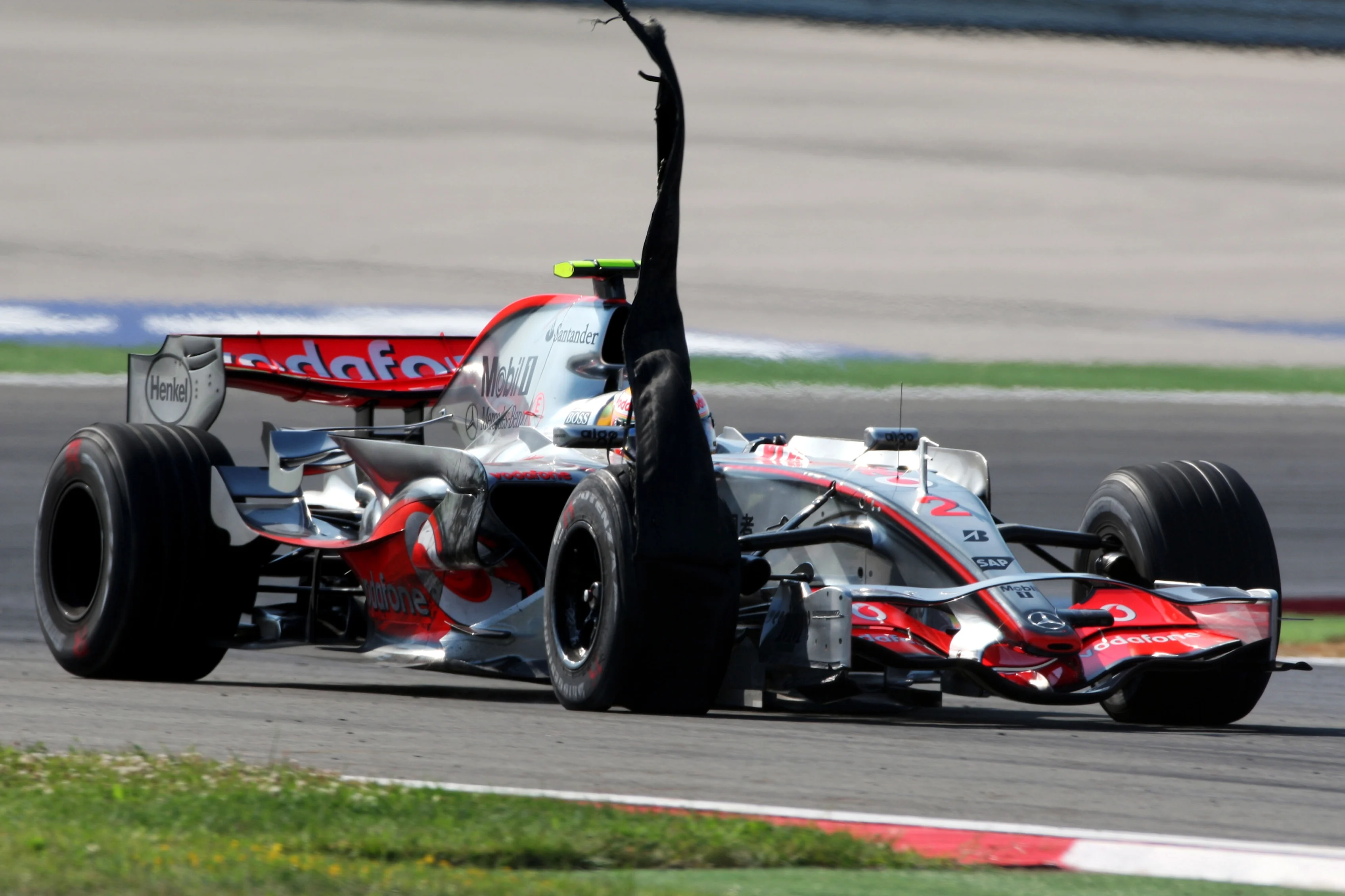 Lewis Hamilton (GBR) McLaren Mercedes MP4/22 suffers a puncture. Formula One World Championship, Rd