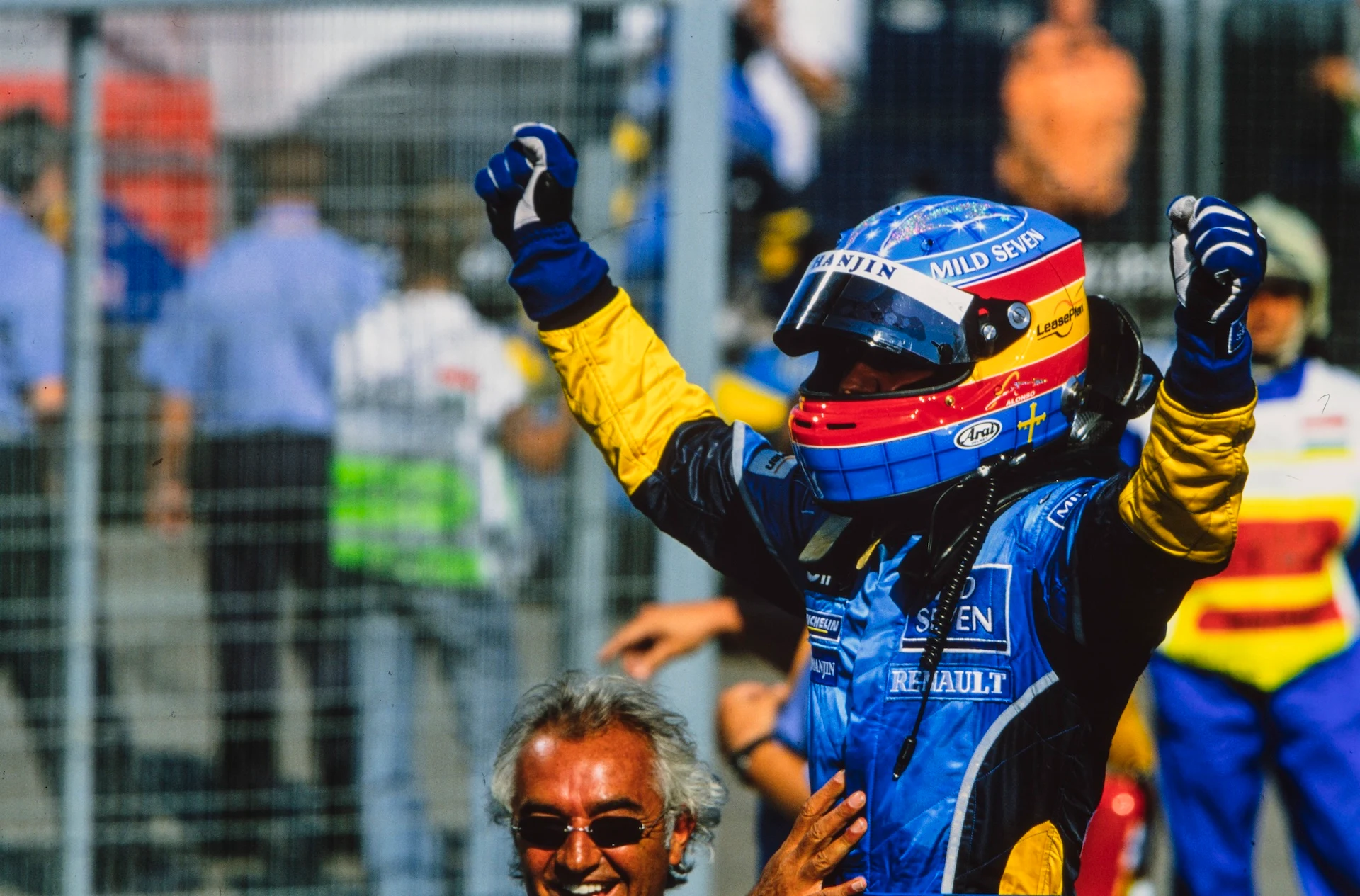 HUNGARORING, HUNGARY - AUGUST 24: Fernando Alonso celebrates his maiden victory in Parc Ferme with