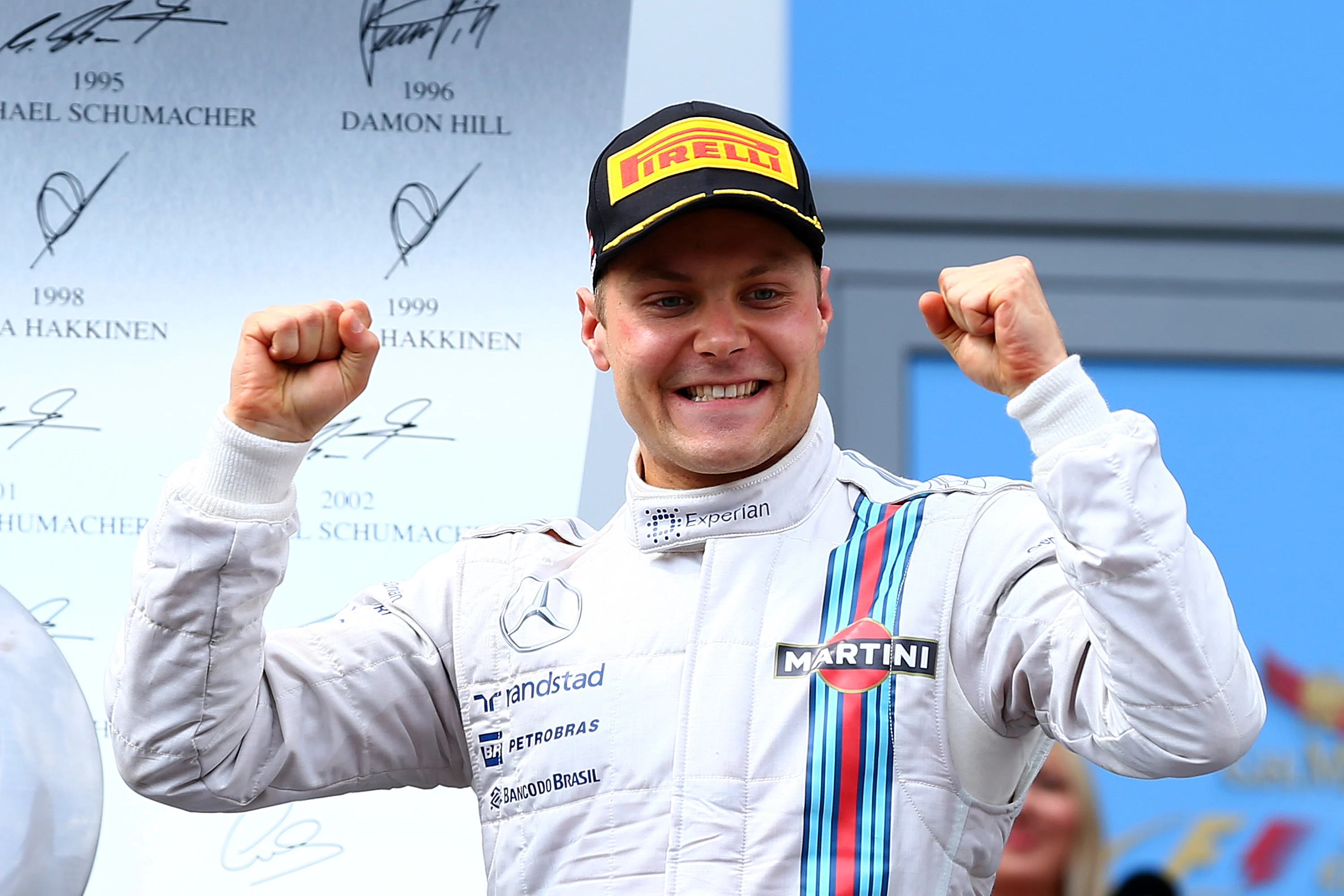 SPIELBERG, AUSTRIA - JUNE 22:  Valtteri Bottas of Finland and Williams celebrates on the podium