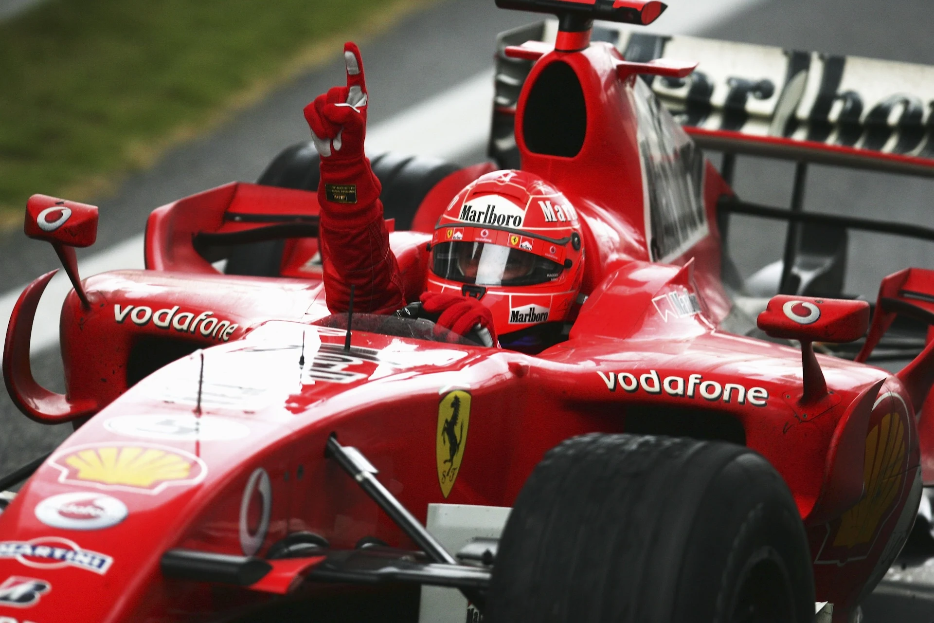 SHANGHAI, CHINA - OCTOBER 01:  Michael Schumacher of Germany and Ferrari celebrates his victory
