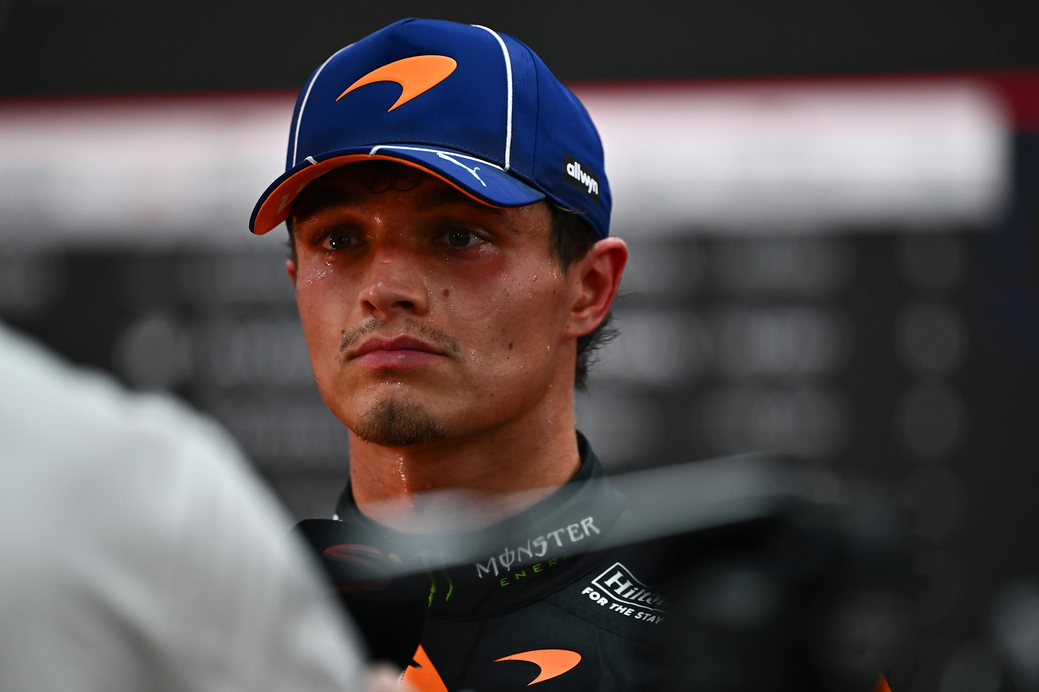 SINGAPORE, SINGAPORE - OCTOBER 10: Lando Norris of Great Britain and McLaren talks to the media