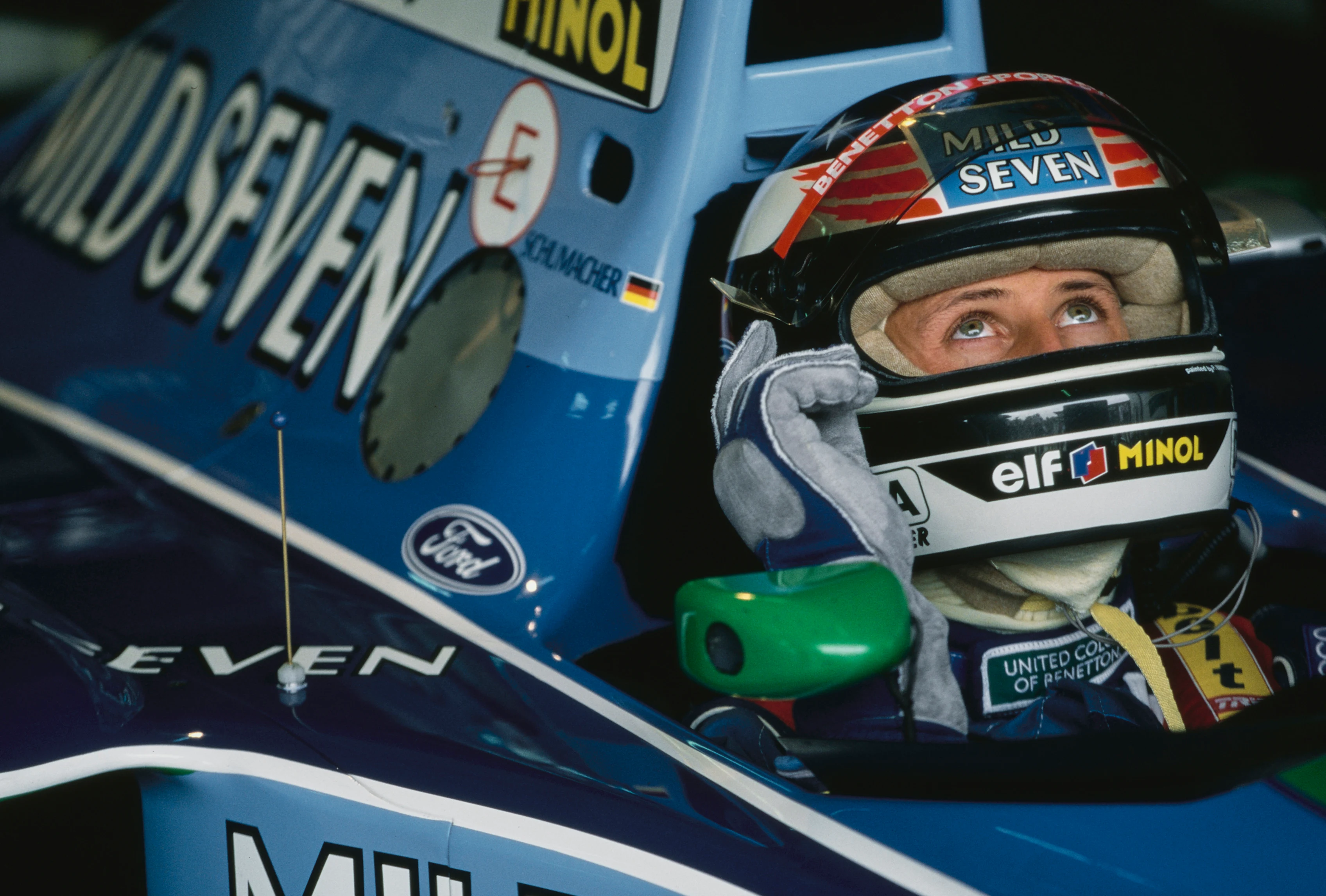 Michael Schumacher from Germany checks the lap times from the cockpit of the #5 Mild Seven Benetton