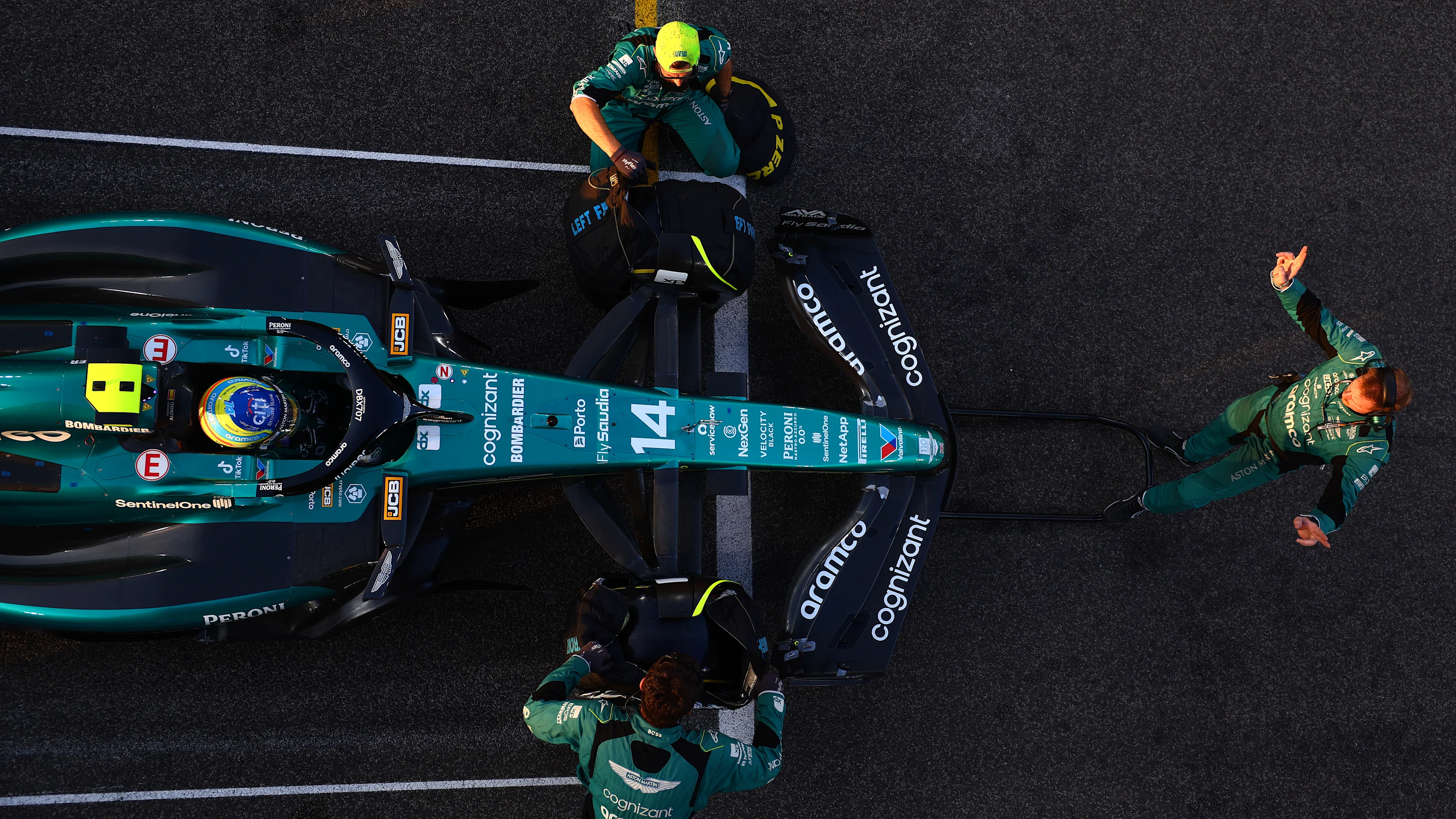 ABU DHABI, UNITED ARAB EMIRATES - NOVEMBER 26: Fernando Alonso of Spain driving the (14) Aston Martin AMR23 Mercedes prepares to drive on the grid during the F1 Grand Prix of Abu Dhabi at Yas Marina Circuit on November 26, 2023 in Abu Dhabi, United Arab Emirates. (Photo by Dan Istitene - Formula 1/Formula 1 via Getty Images)