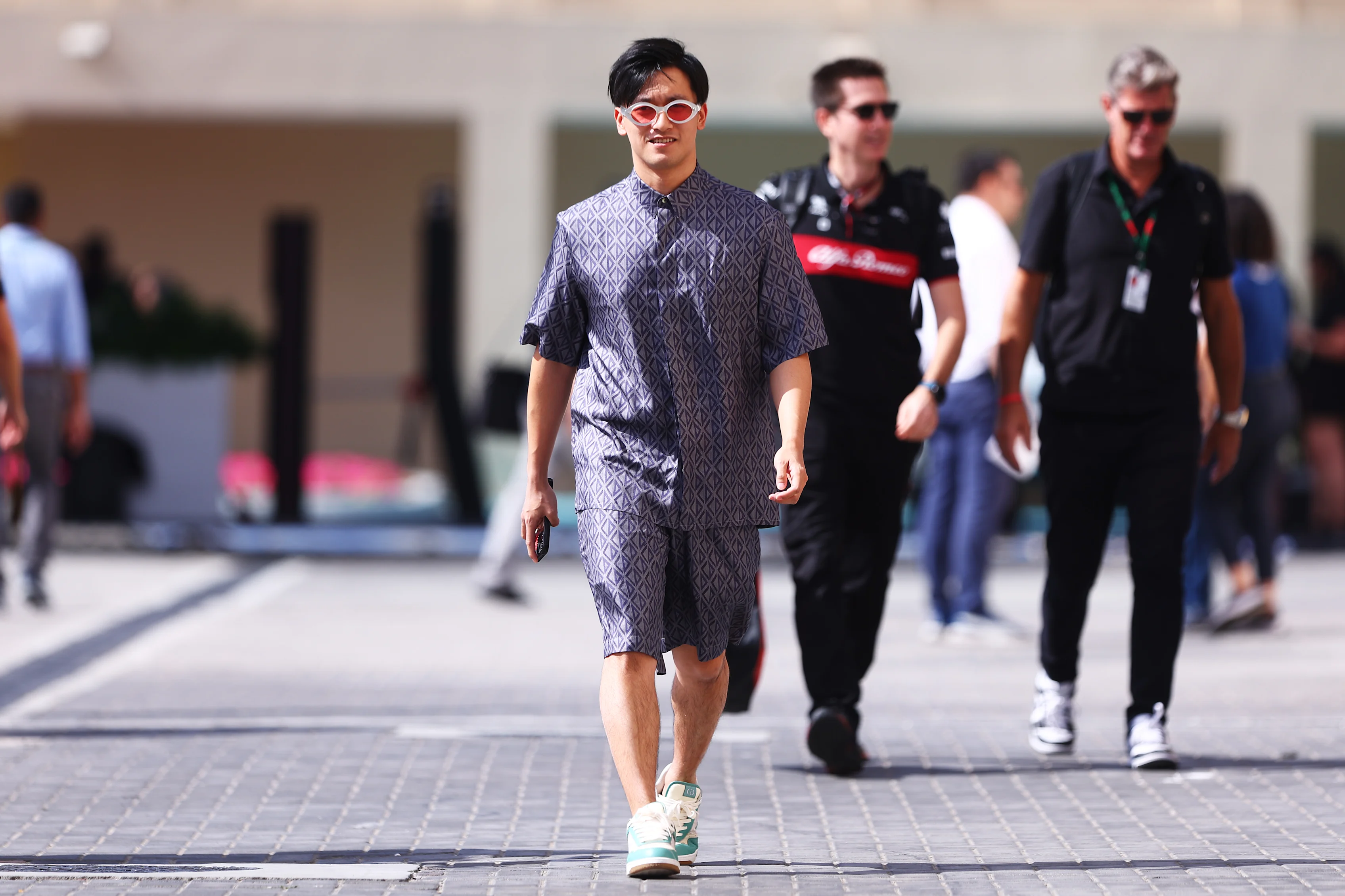 ABU DHABI, UNITED ARAB EMIRATES - NOVEMBER 23: Zhou Guanyu of China and Alfa Romeo F1 walks in the