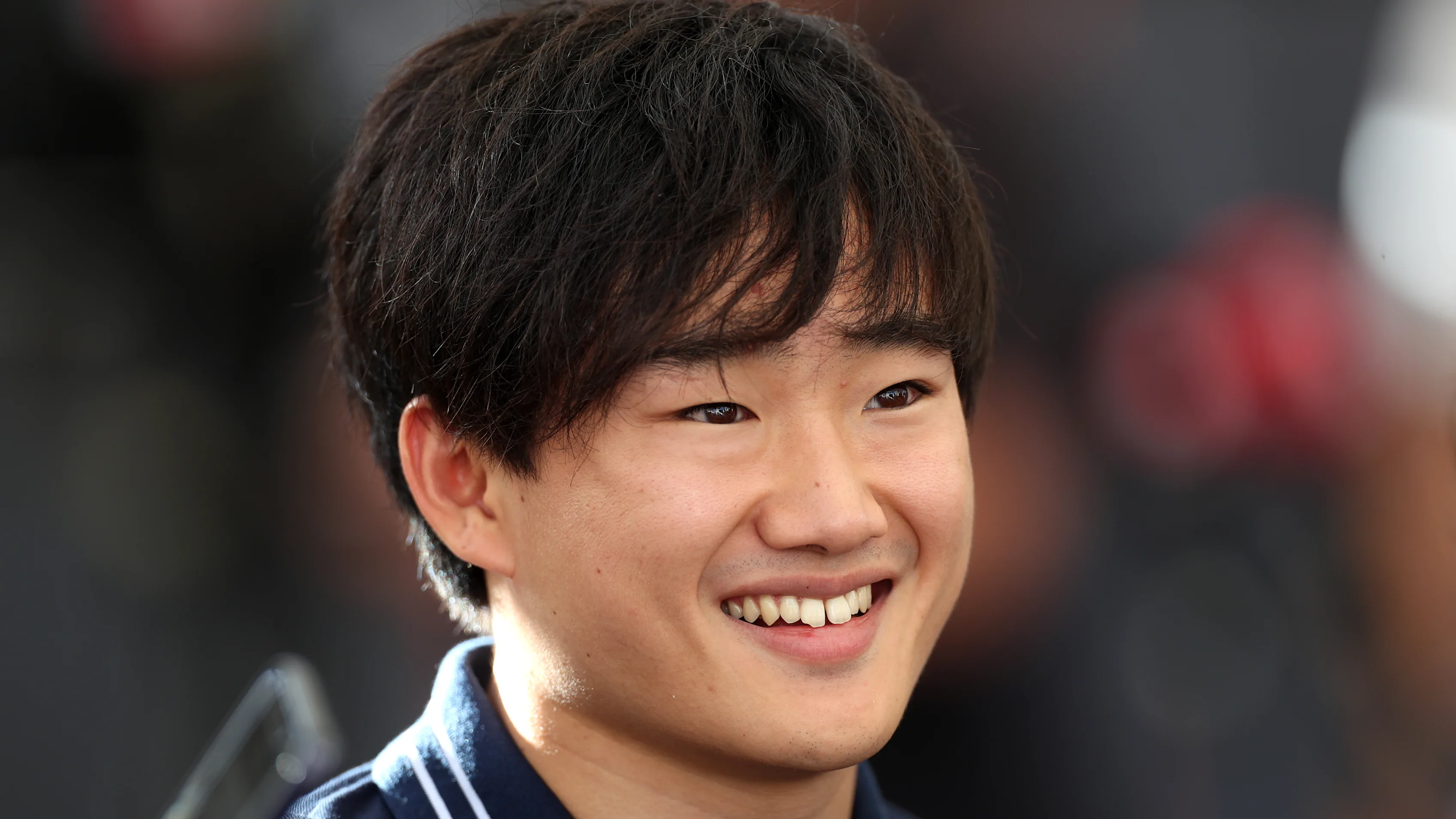 ABU DHABI, UNITED ARAB EMIRATES - NOVEMBER 23: Yuki Tsunoda of Japan and Scuderia AlphaTauri talks