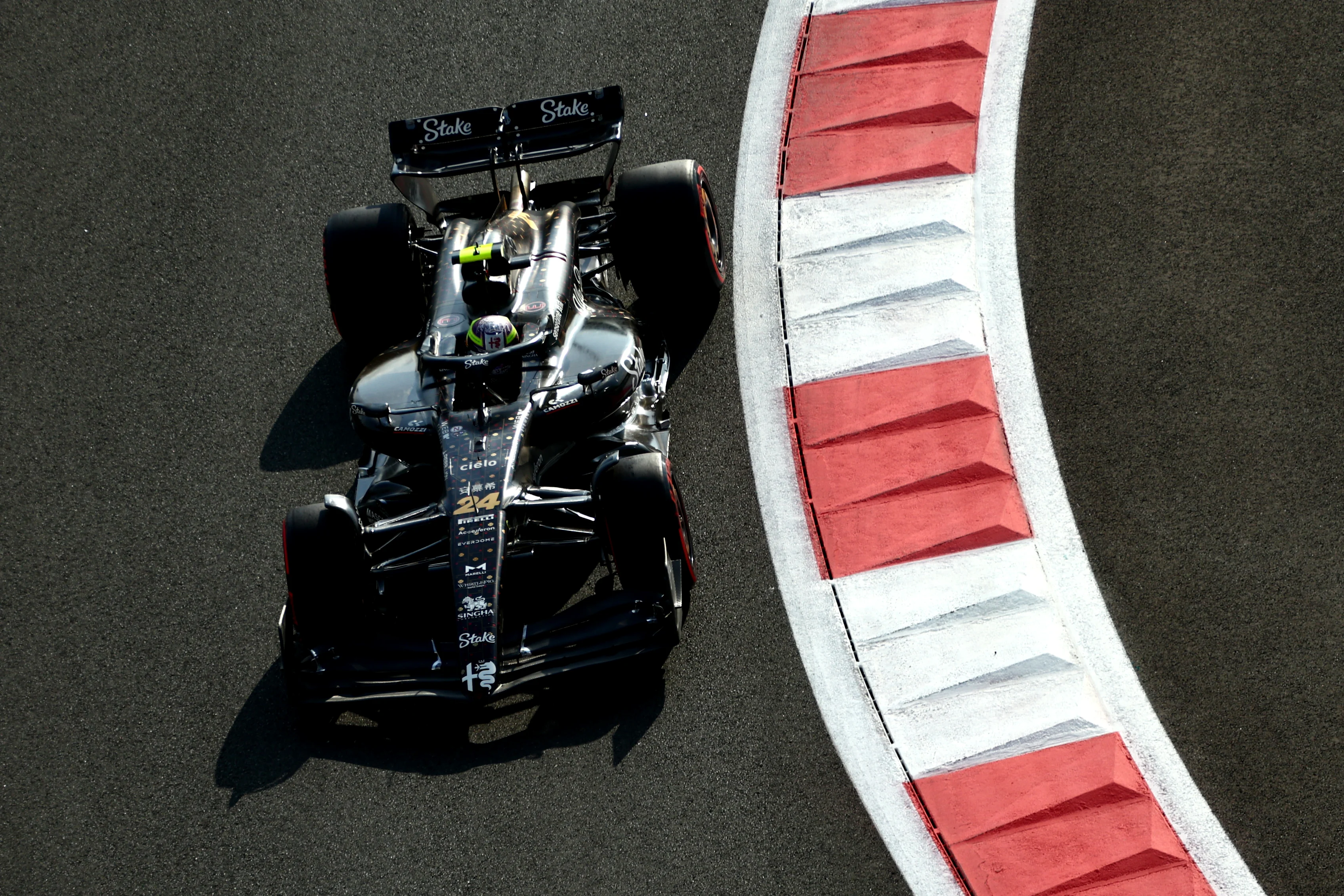 ABU DHABI, UNITED ARAB EMIRATES - NOVEMBER 25: Zhou Guanyu of China driving the (24) Alfa Romeo F1
