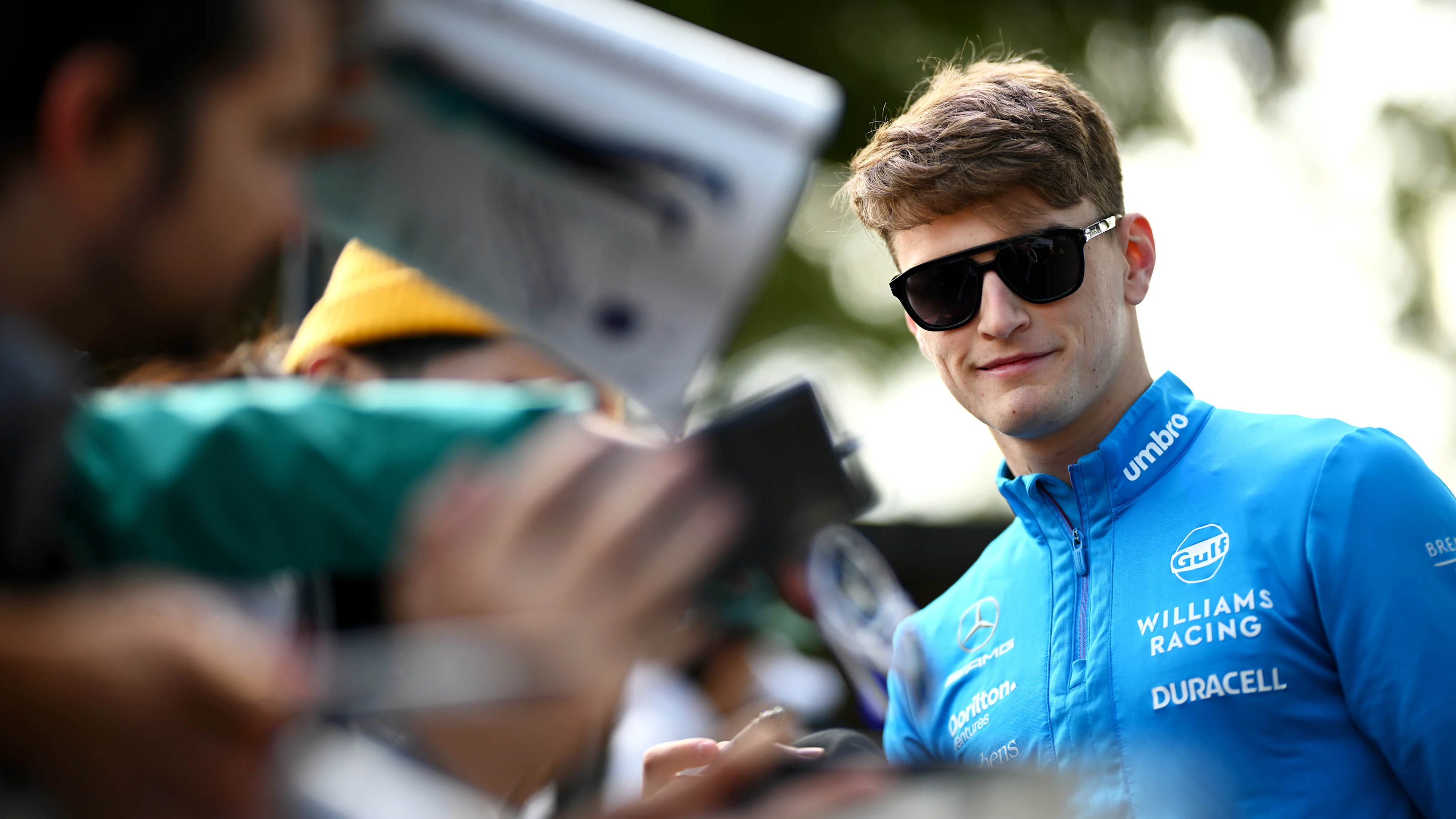MELBOURNE, AUSTRALIA - MARCH 30: Logan Sargeant of United States and Williams greets fans on the