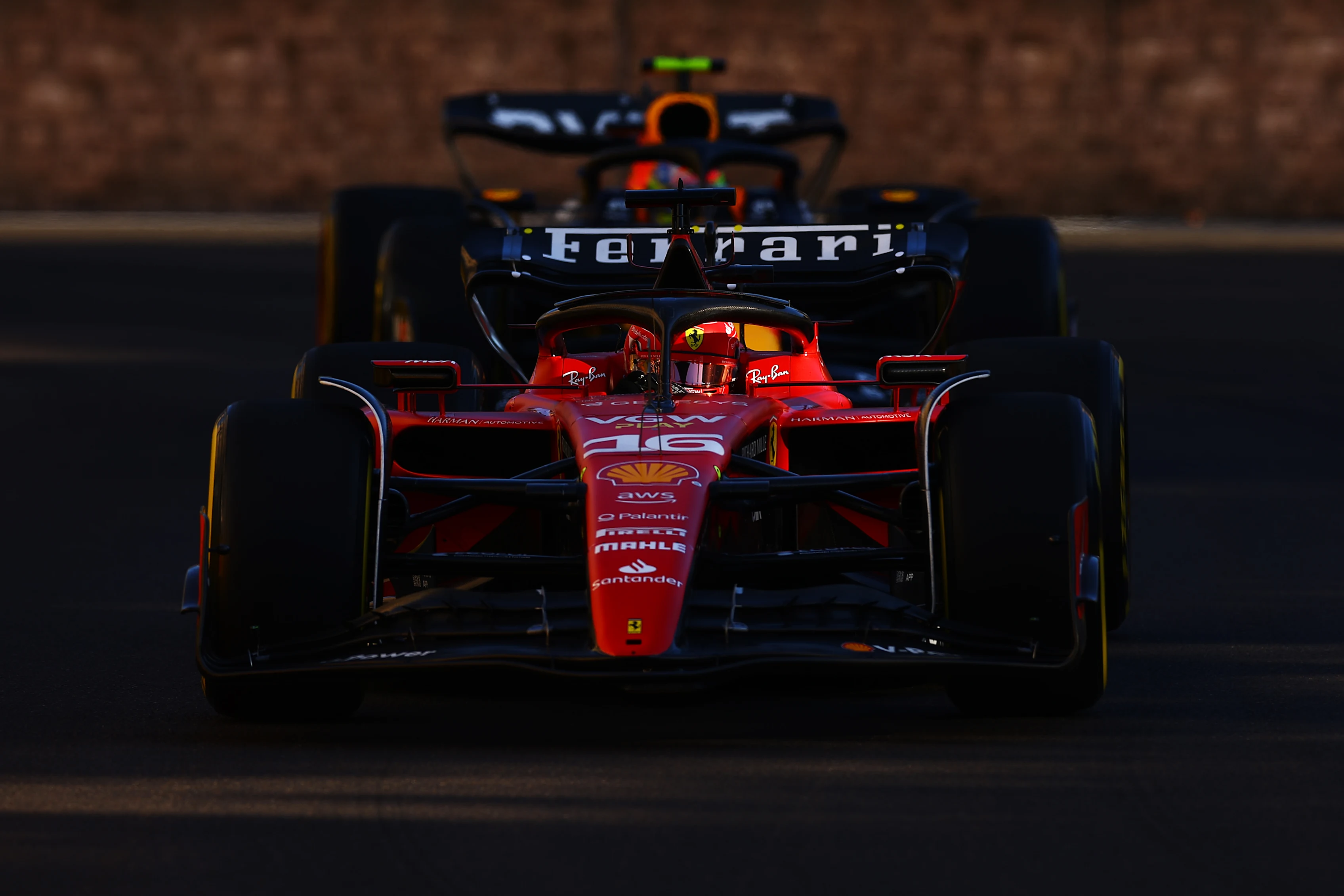 BAKU, AZERBAIJAN - APRIL 29: Charles Leclerc of Monaco driving the (16) Ferrari SF-23 leads Sergio Perez of Mexico driving the (11) Oracle Red Bull Racing RB19 on track during the Sprint ahead of the F1 Grand Prix of Azerbaijan at Baku City Circuit on April 29, 2023 in Baku, Azerbaijan. (Photo by Alex Pantling/Getty Images)