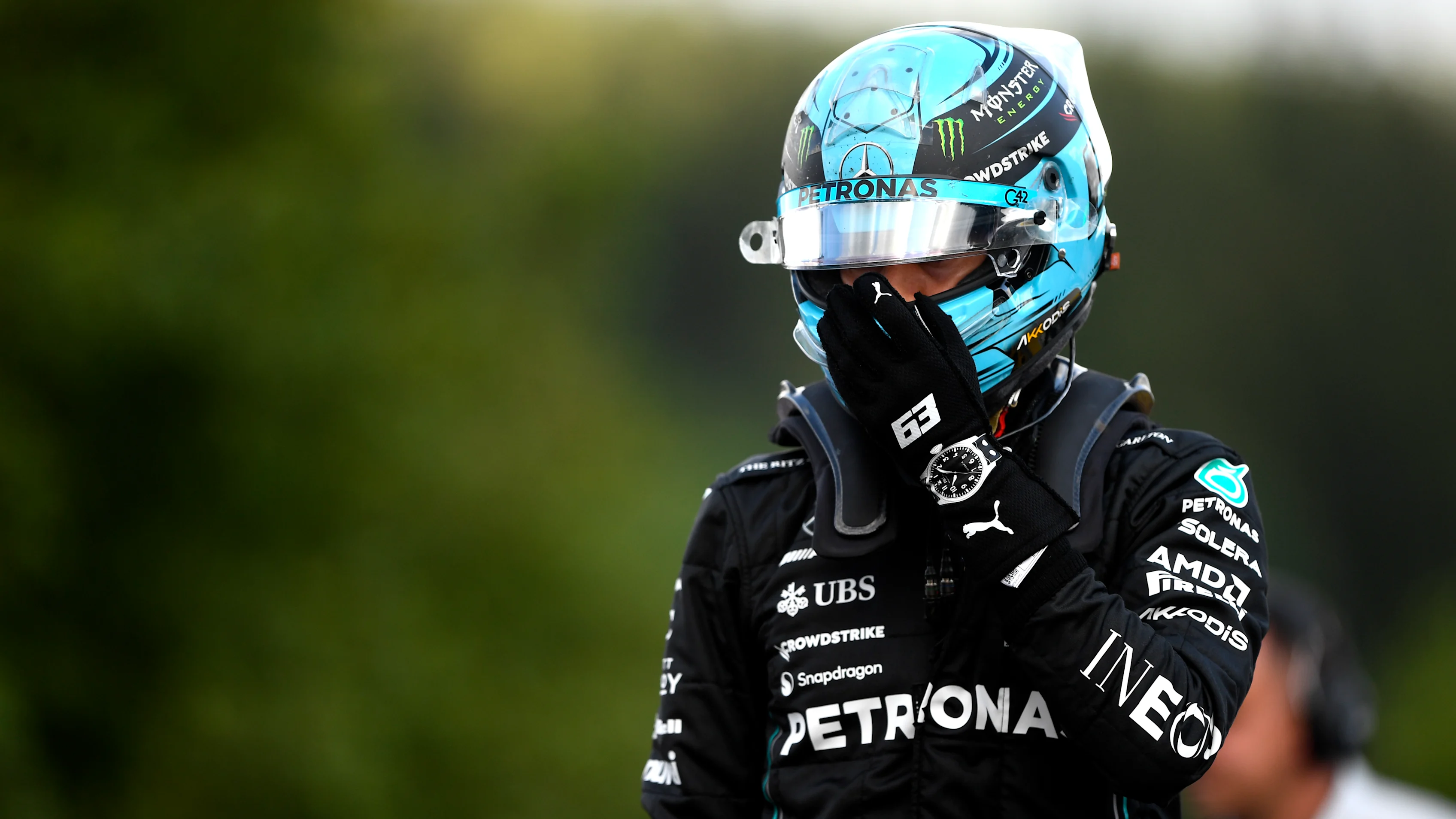SPA, BELGIUM - JULY 28: 8th placed qualifier George Russell of Great Britain and Mercedes walks in