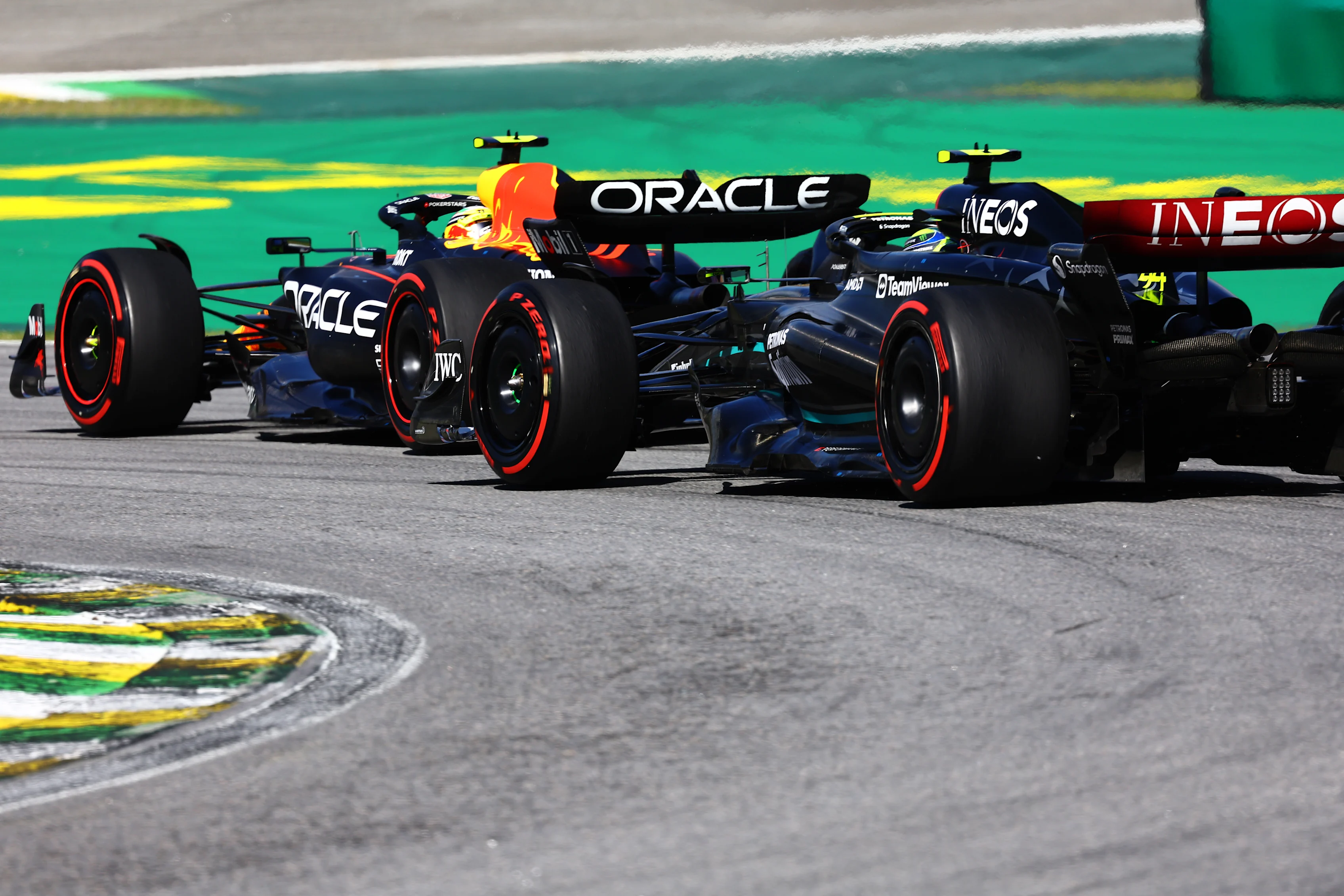 SAO PAULO, BRAZIL - NOVEMBER 05: Lewis Hamilton of Great Britain driving the (44) Mercedes AMG Petronas F1 Team W14 chases Sergio Perez of Mexico driving the (11) Oracle Red Bull Racing RB19 on track during the F1 Grand Prix of Brazil at Autodromo Jose Carlos Pace on November 05, 2023 in Sao Paulo, Brazil. (Photo by Mark Thompson/Getty Images)