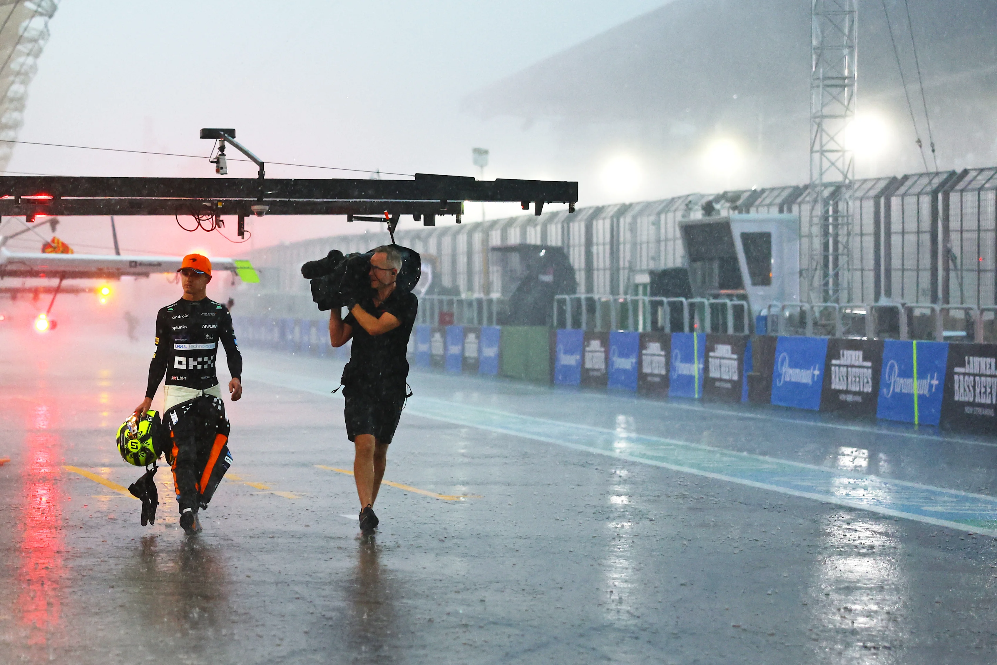 SAO PAULO, BRAZIL - NOVEMBER 03: Seventh placed qualifier Lando Norris of Great Britain and McLaren walks in the Pitlane during qualifying ahead of the F1 Grand Prix of Brazil at Autodromo Jose Carlos Pace on November 03, 2023 in Sao Paulo, Brazil. (Photo by Mark Thompson/Getty Images)