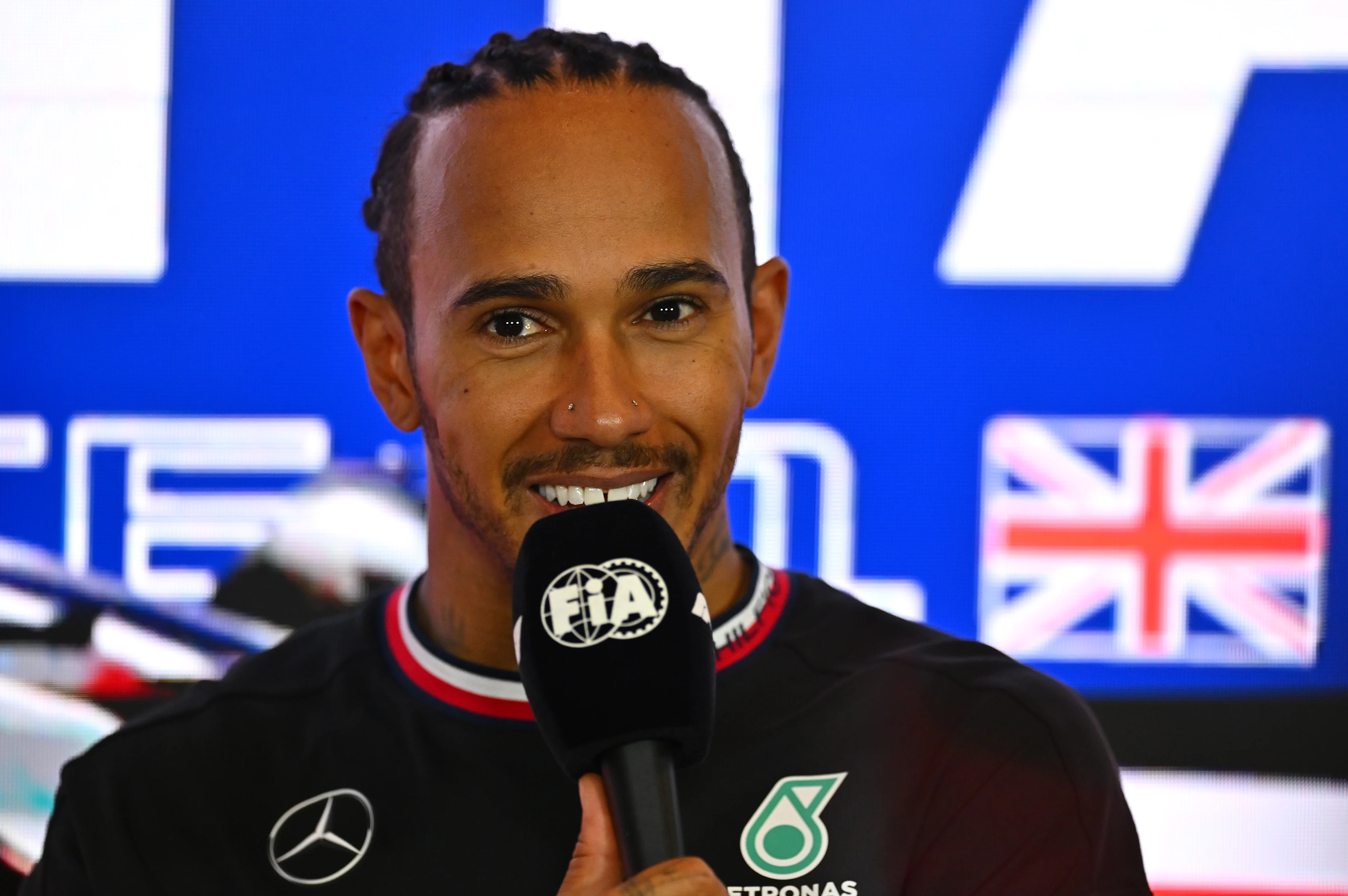 NORTHAMPTON, ENGLAND - JULY 09: Third placed Lewis Hamilton of Great Britain and Mercedes attends