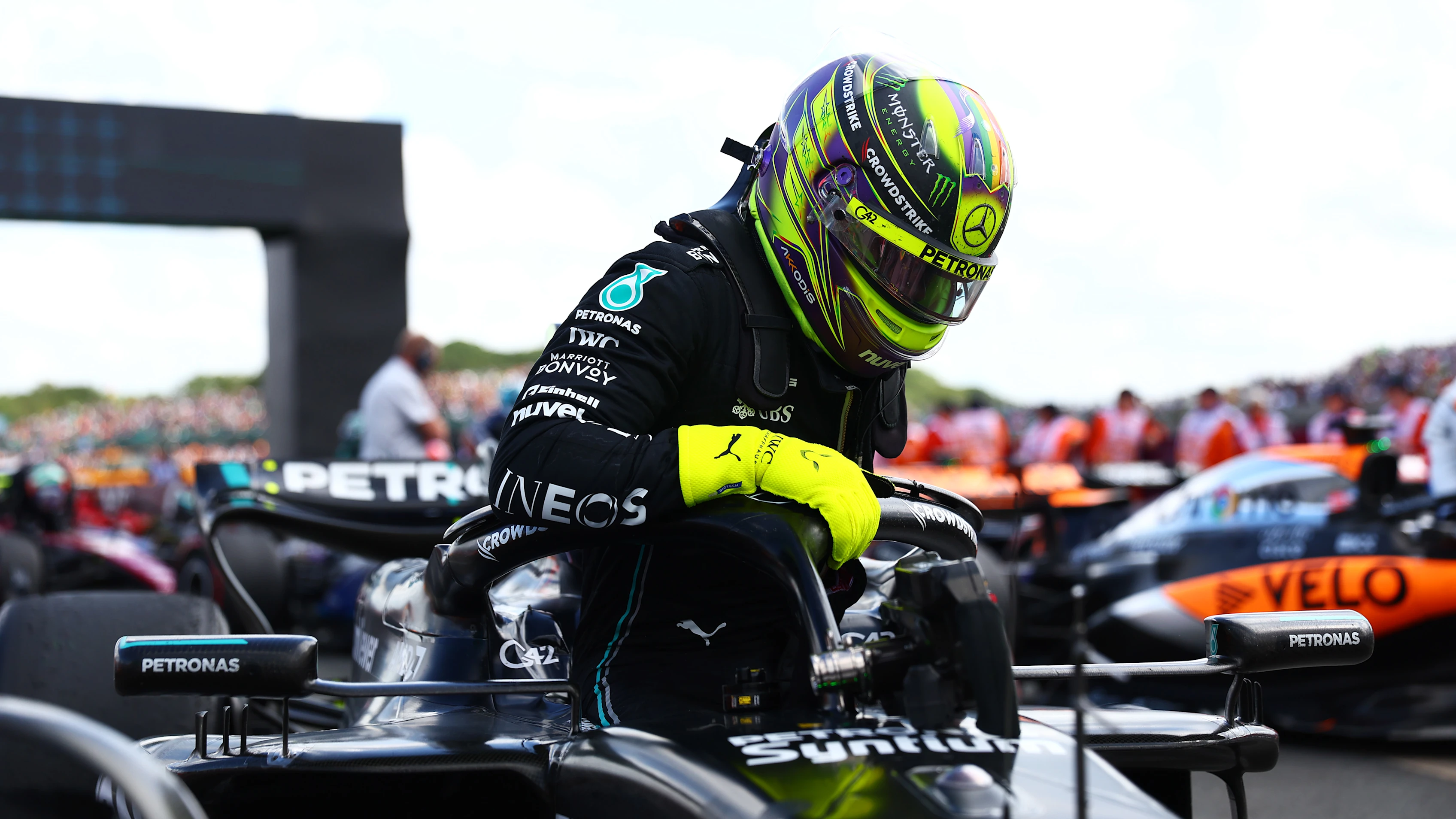 NORTHAMPTON, ENGLAND - JULY 09: Third placed Lewis Hamilton of Great Britain and Mercedes stops in