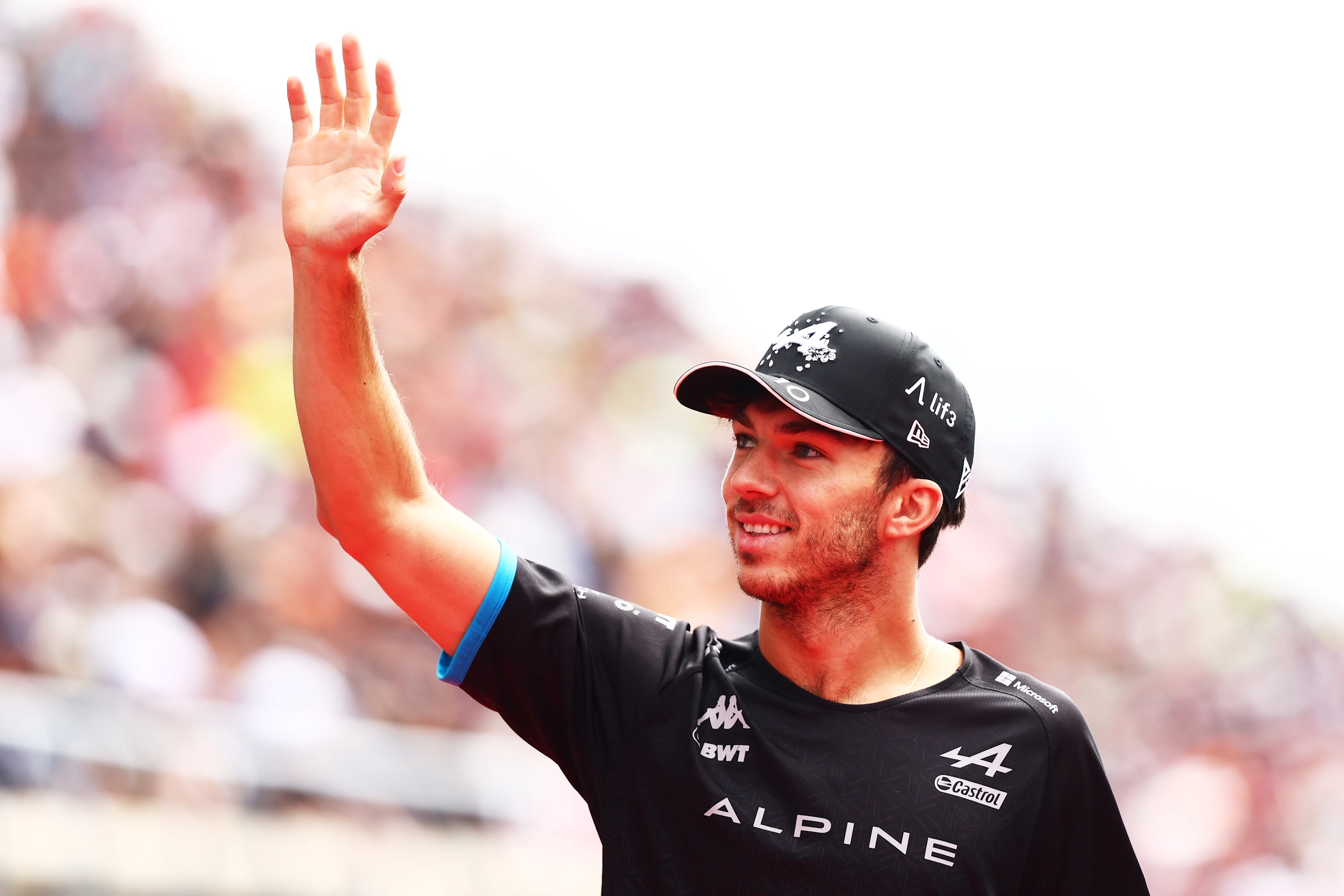 SUZUKA, JAPAN - SEPTEMBER 24: Pierre Gasly of France and Alpine F1 waves from the drivers parade prior to the F1 Grand Prix of Japan at Suzuka International Racing Course on September 24, 2023 in Suzuka, Japan. (Photo by Clive Rose/Getty Images)