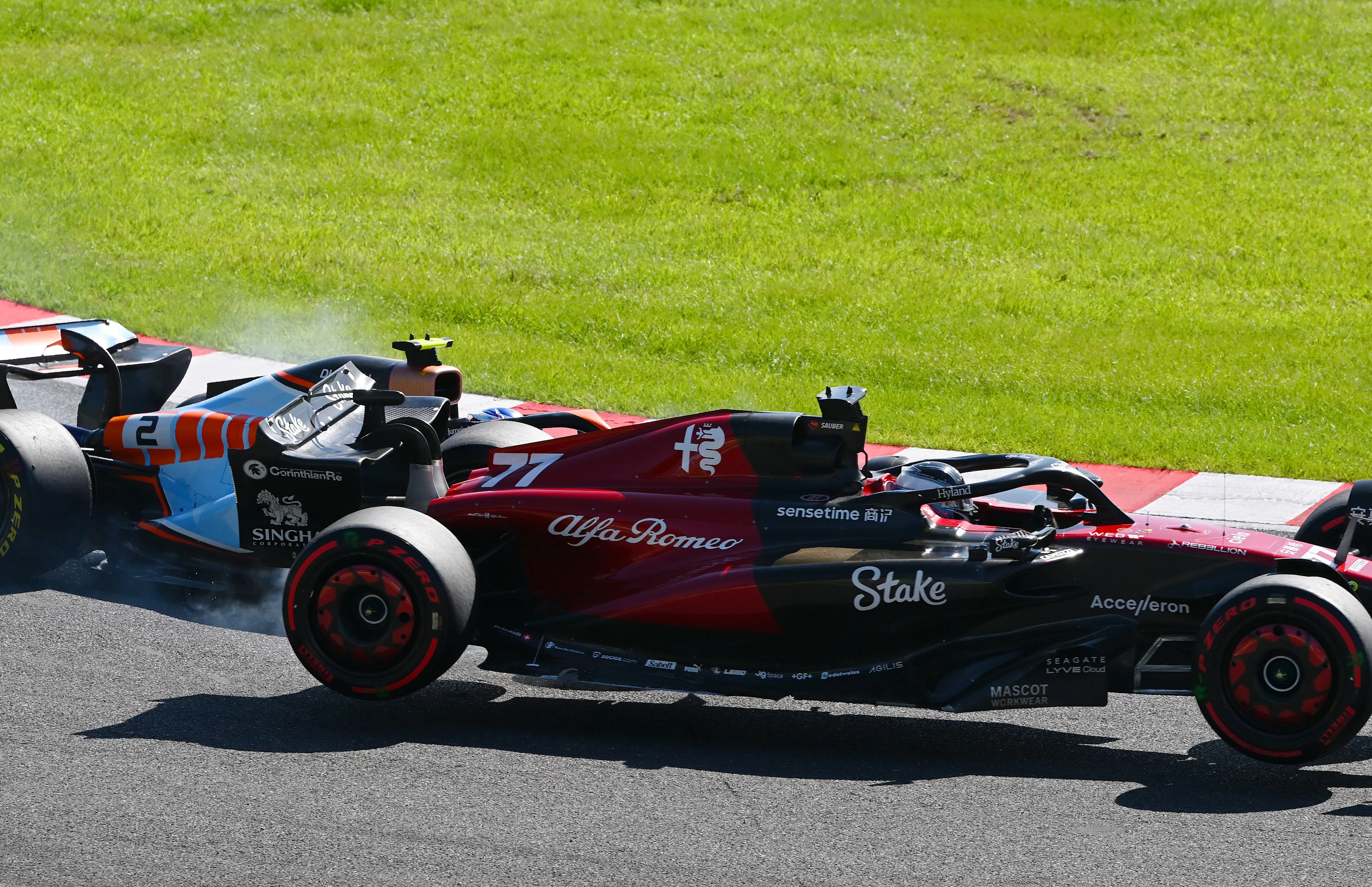 SUZUKA, JAPAN - SEPTEMBER 24: Valtteri Bottas of Finland driving the (77) Alfa Romeo F1 C43 Ferrari collides with Logan Sargeant of United States driving the (2) Williams FW45 Mercedes during the F1 Grand Prix of Japan at Suzuka International Racing Course on September 24, 2023 in Suzuka, Japan. (Photo by Clive Mason/Getty Images)
