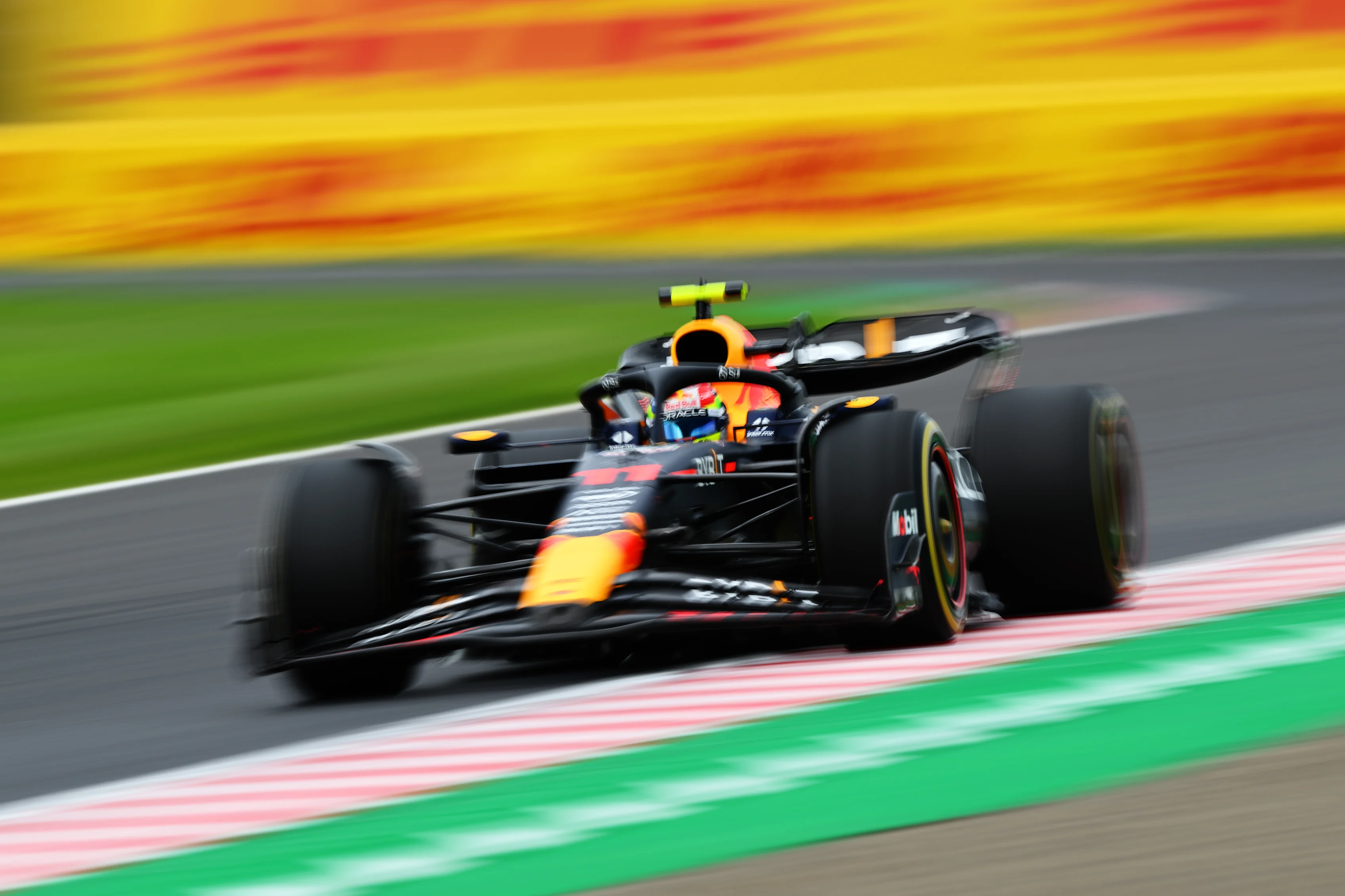 SUZUKA, JAPAN - SEPTEMBER 22: Sergio Perez of Mexico driving the (11) Oracle Red Bull Racing RB19 on track during practice ahead of the F1 Grand Prix of Japan at Suzuka International Racing Course on September 22, 2023 in Suzuka, Japan. (Photo by Clive Mason/Getty Images)