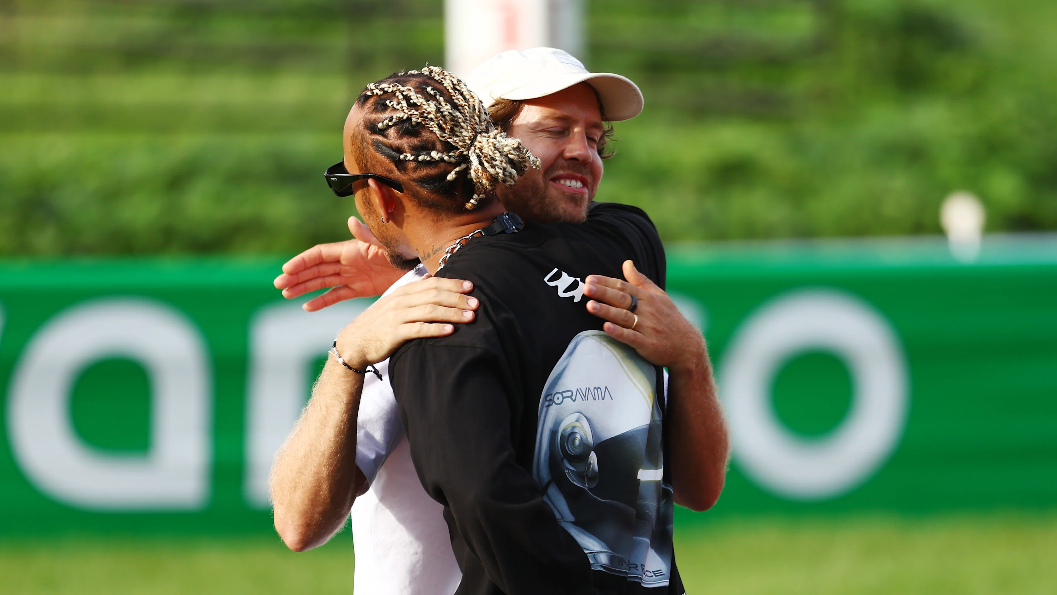 SUZUKA, JAPAN - SEPTEMBER 21: Lewis Hamilton of Great Britain and Mercedes and Sebastian Vettel