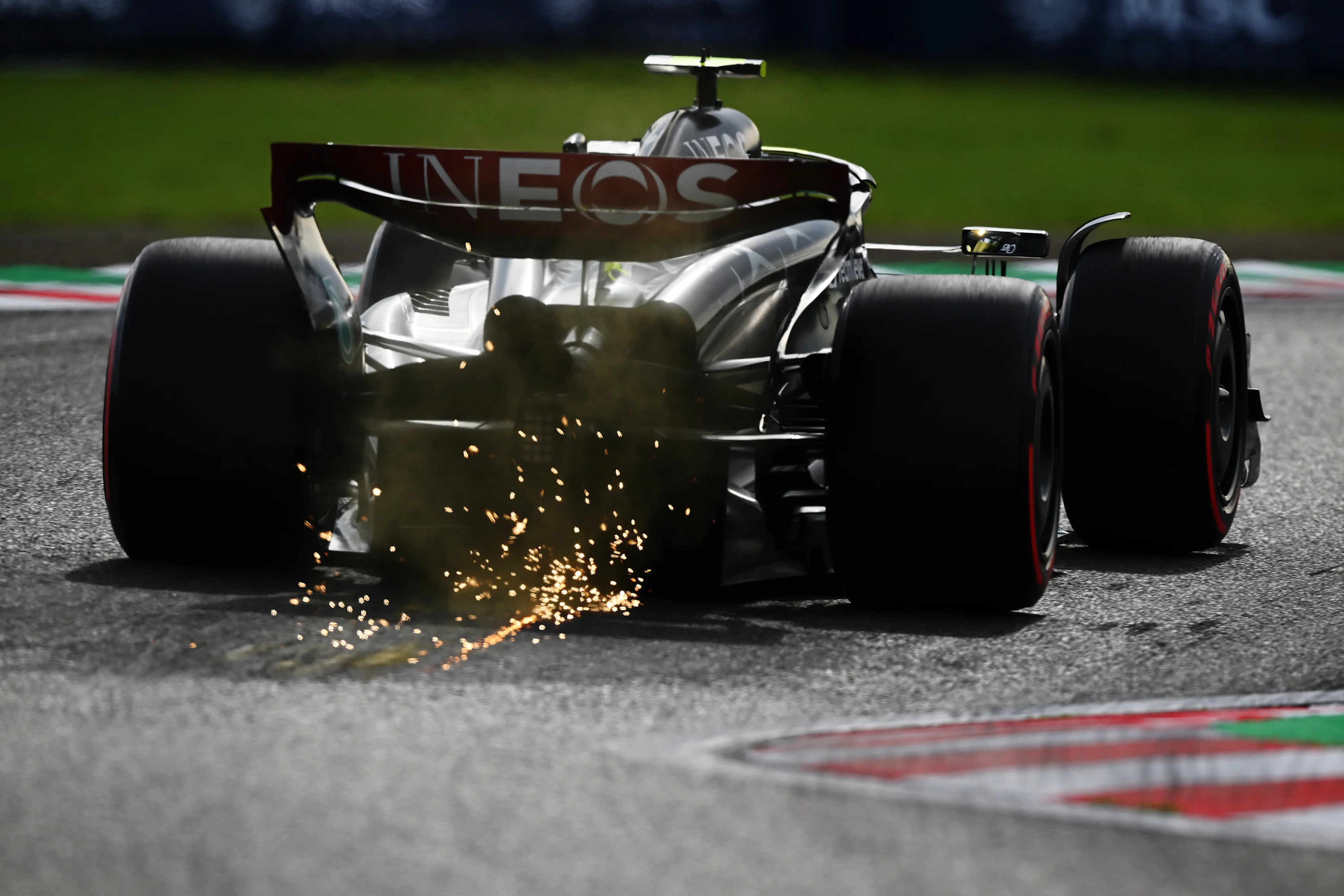 SUZUKA, JAPAN - SEPTEMBER 23: Sparks fly behind Lewis Hamilton of Great Britain driving the (44) Mercedes AMG Petronas F1 Team W14 during qualifying ahead of the F1 Grand Prix of Japan at Suzuka International Racing Course on September 23, 2023 in Suzuka, Japan. (Photo by Clive Mason/Getty Images)