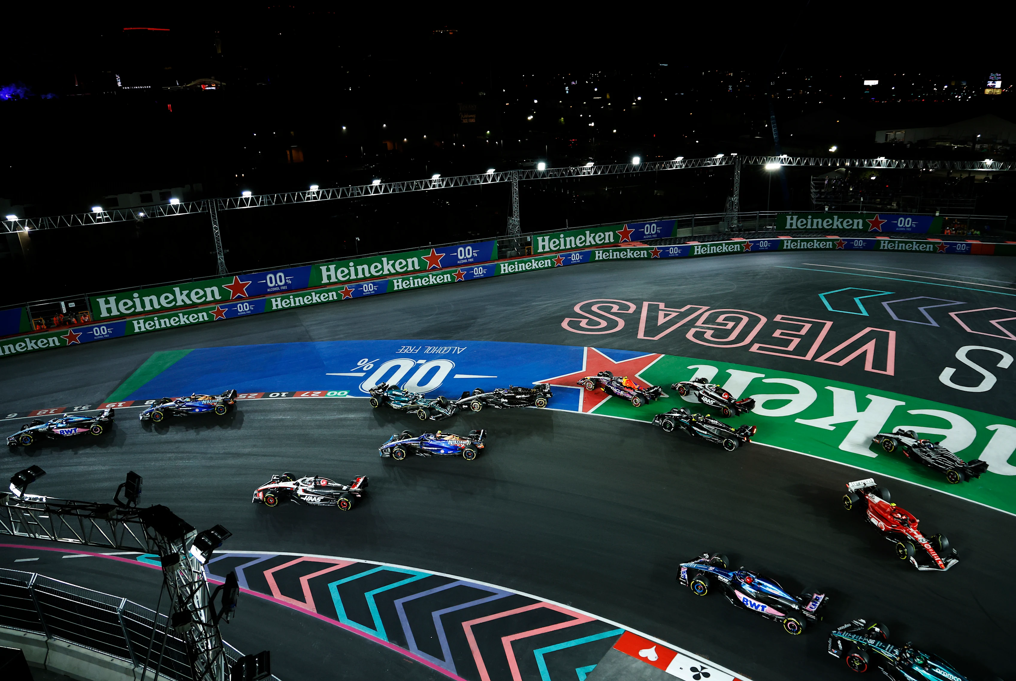 LAS VEGAS, NEVADA - NOVEMBER 18: Fernando Alonso of Spain driving the (14) Aston Martin AMR23 Mercedes and Valtteri Bottas of Finland driving the (77) Alfa Romeo F1 C43 Ferrari collide at turn one during the F1 Grand Prix of Las Vegas at Las Vegas Strip Circuit on November 18, 2023 in Las Vegas, Nevada. (Photo by Chris Graythen/Getty Images)