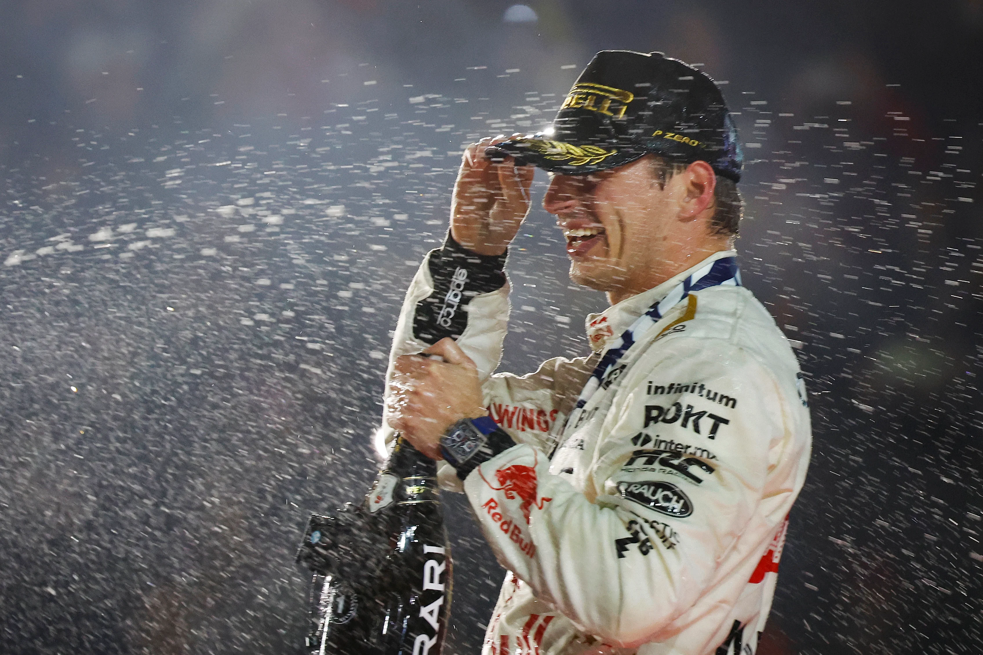 LAS VEGAS, NEVADA - NOVEMBER 18: Race winner Max Verstappen of the Netherlands and Oracle Red Bull Racing celebrates on the podium during the F1 Grand Prix of Las Vegas at Las Vegas Strip Circuit on November 18, 2023 in Las Vegas, Nevada. (Photo by Chris Graythen/Getty Images)