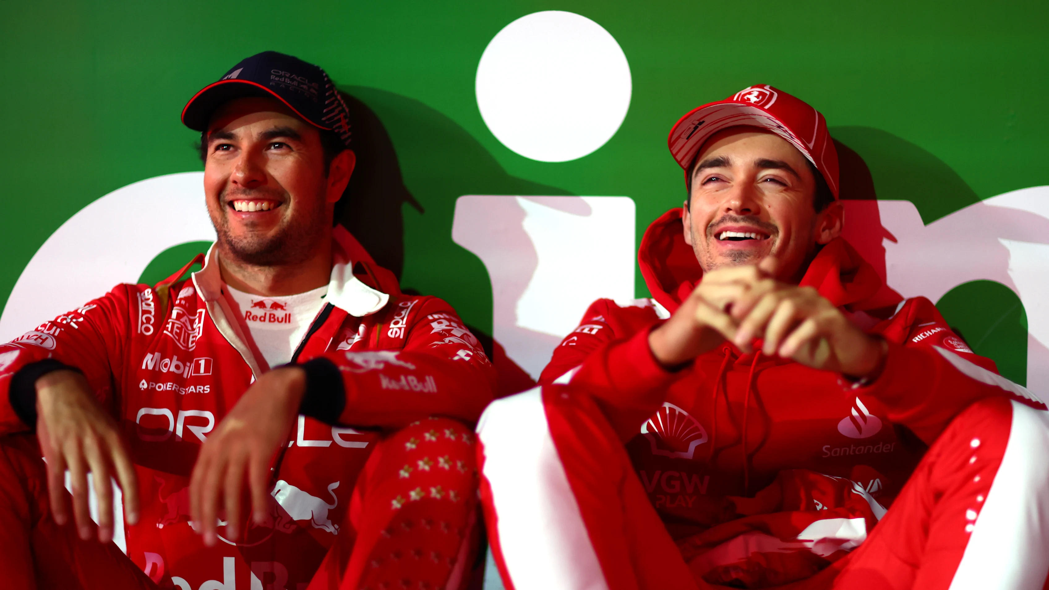 LAS VEGAS, NEVADA - NOVEMBER 18: Third placed Sergio Perez of Oracle Red Bull Racing and Second placed Charles Leclerc of Monaco and Ferrari react during the F1 Grand Prix of Las Vegas at Las Vegas Strip Circuit on November 18, 2023 in Las Vegas, Nevada. (Photo by Dan Istitene - Formula 1/Formula 1 via Getty Images)