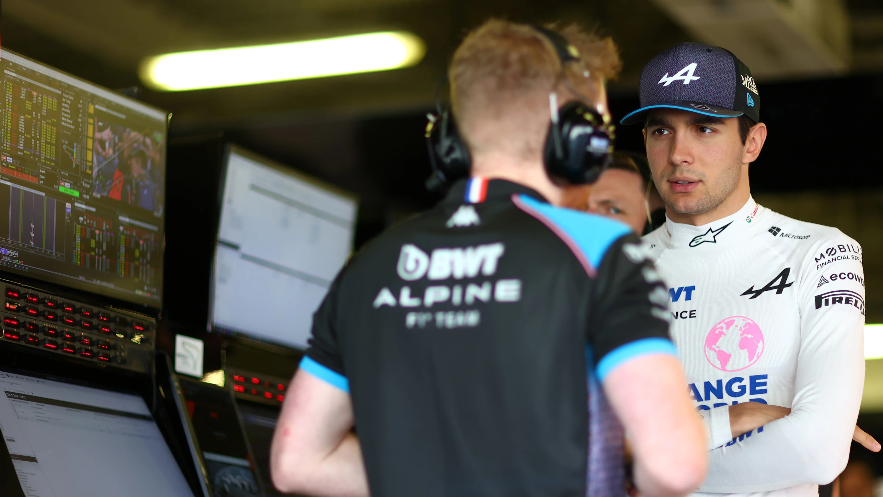 MEXICO CITY, MEXICO - OCTOBER 27: Esteban Ocon of France and Alpine F1 talks with Alpine F1 team members in the garage  during practice ahead of the F1 Grand Prix of Mexico at Autodromo Hermanos Rodriguez on October 27, 2023 in Mexico City, Mexico. (Photo by Dan Istitene - Formula 1/Formula 1 via Getty Images)