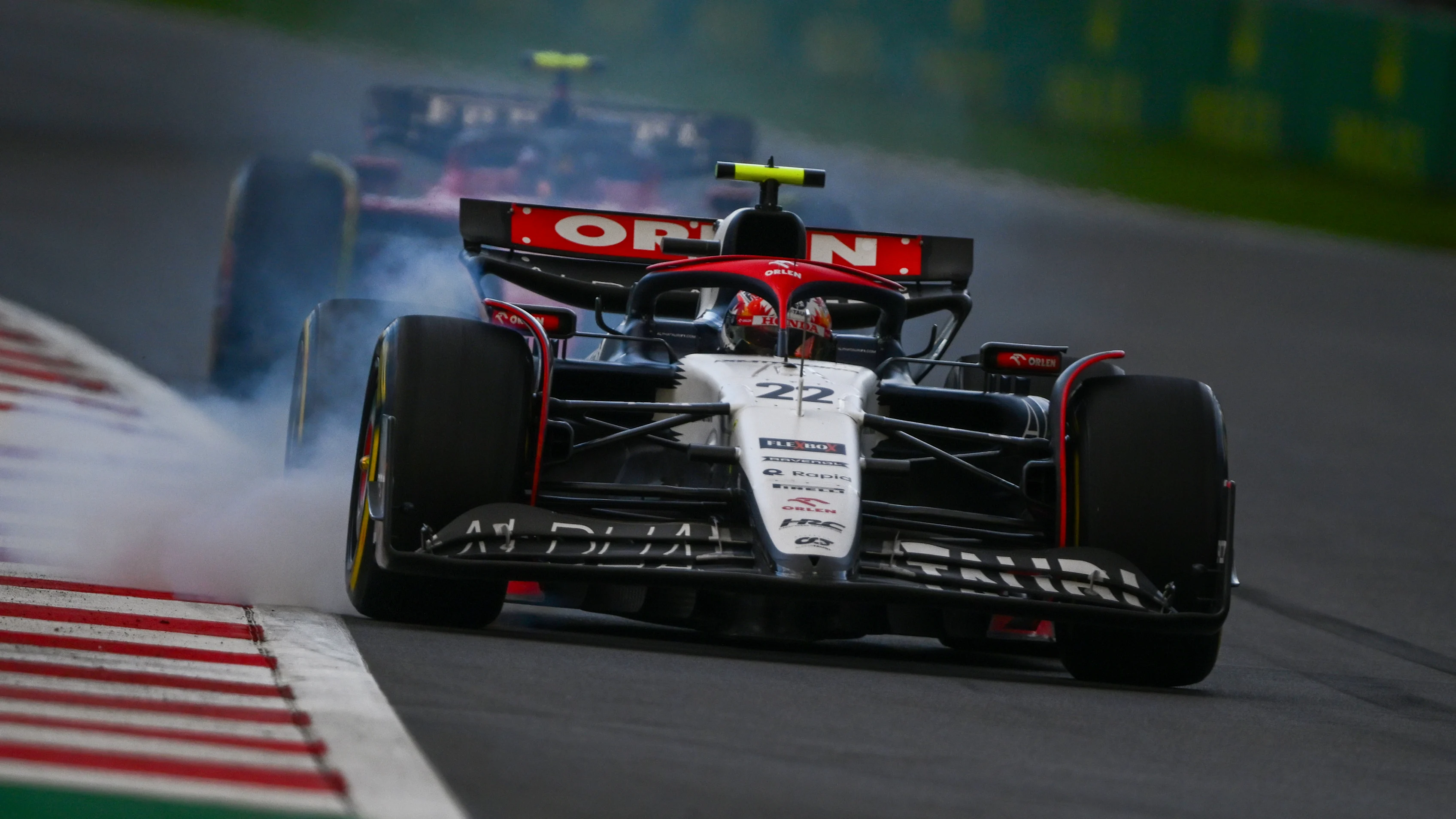 MEXICO CITY, MEXICO - OCTOBER 27: Yuki Tsunoda of Japan driving the (22) Scuderia AlphaTauri AT04 locks up on track during practice ahead of the F1 Grand Prix of Mexico at Autodromo Hermanos Rodriguez on October 27, 2023 in Mexico City, Mexico. (Photo by Clive Mason - Formula 1/Formula 1 via Getty Images)