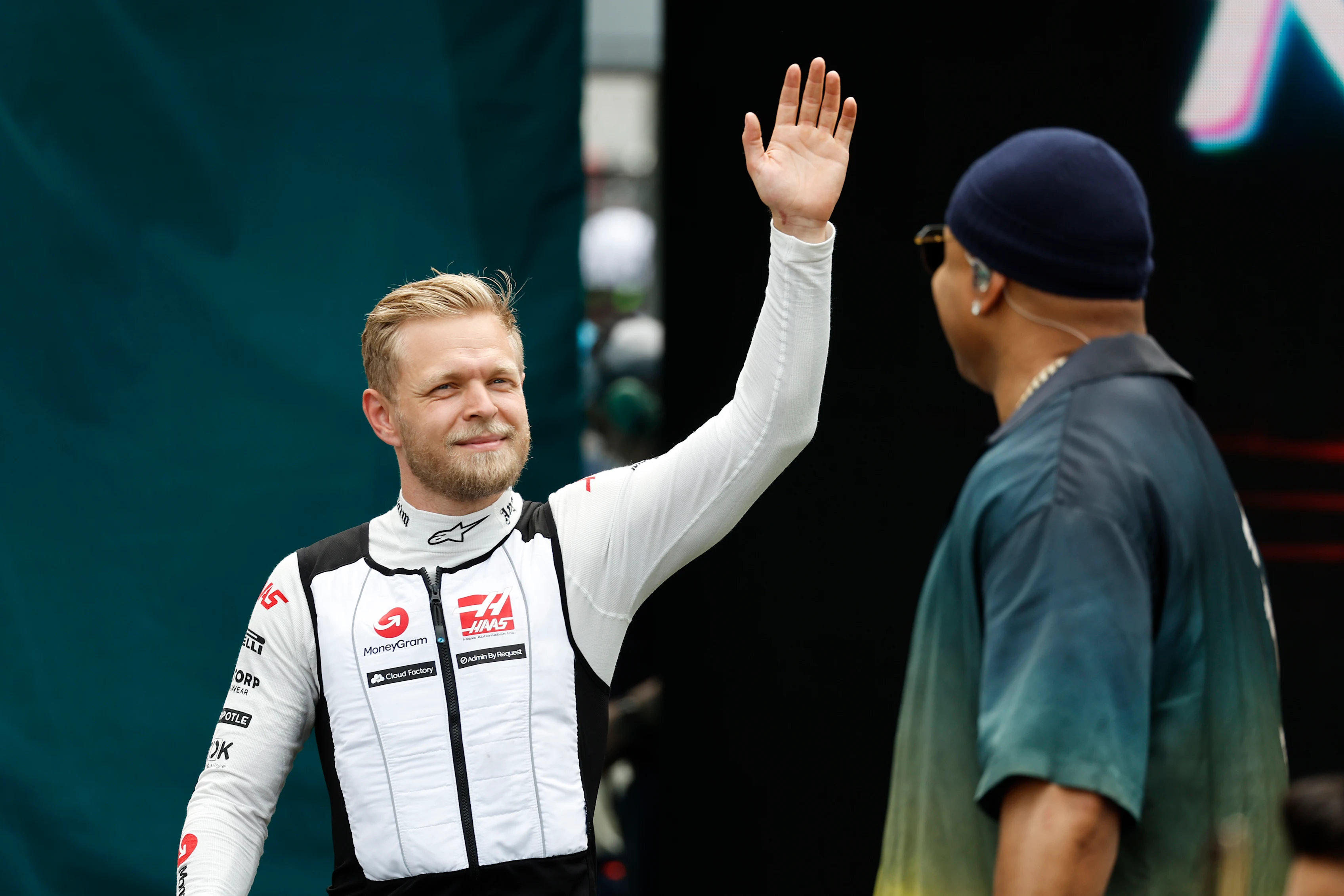 MIAMI, FLORIDA - MAY 07: Kevin Magnussen of Denmark and Haas F1 walks on the grid prior to the F1