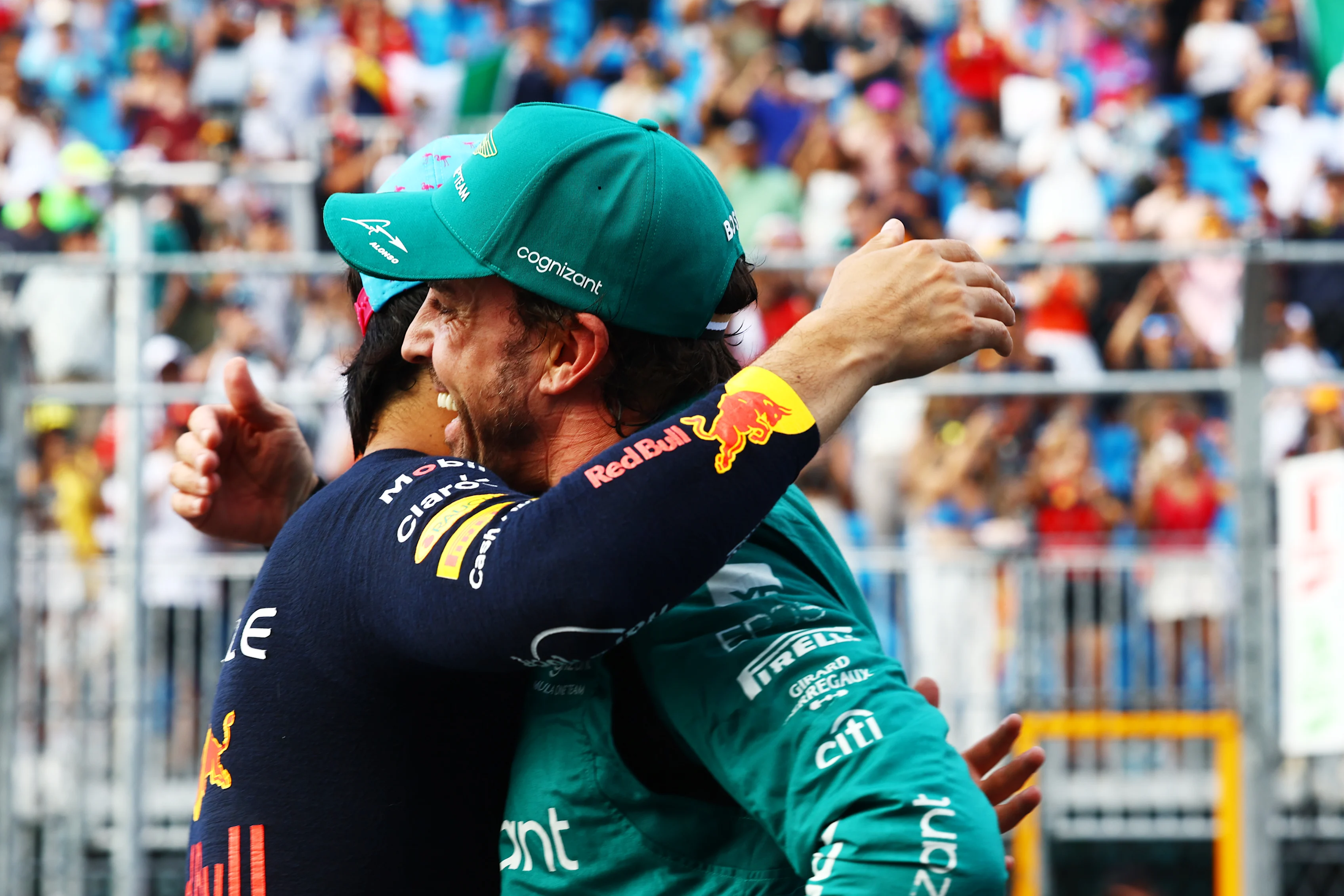MIAMI, FLORIDA - MAY 06: Second placed qualifier Fernando Alonso of Spain and Aston Martin F1 Team and Pole position qualifier Sergio Perez of Mexico and Oracle Red Bull Racing talk in parc ferme during qualifying ahead of the F1 Grand Prix of Miami at Miami International Autodrome on May 06, 2023 in Miami, Florida. (Photo by Mark Thompson/Getty Images)