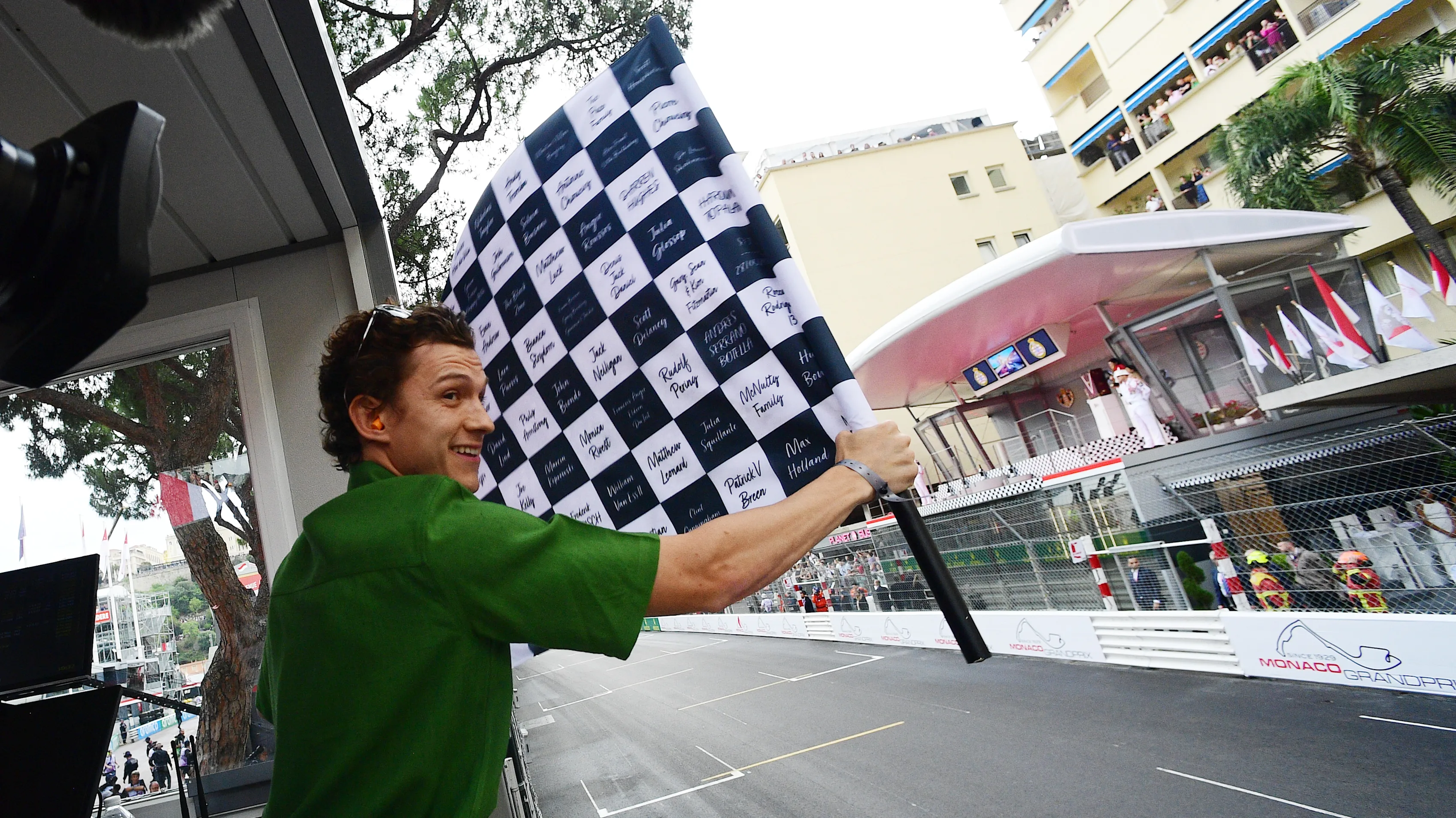 MONTE-CARLO, MONACO - MAY 28: Tom Holland waves the chequered flag during the F1 Grand Prix of
