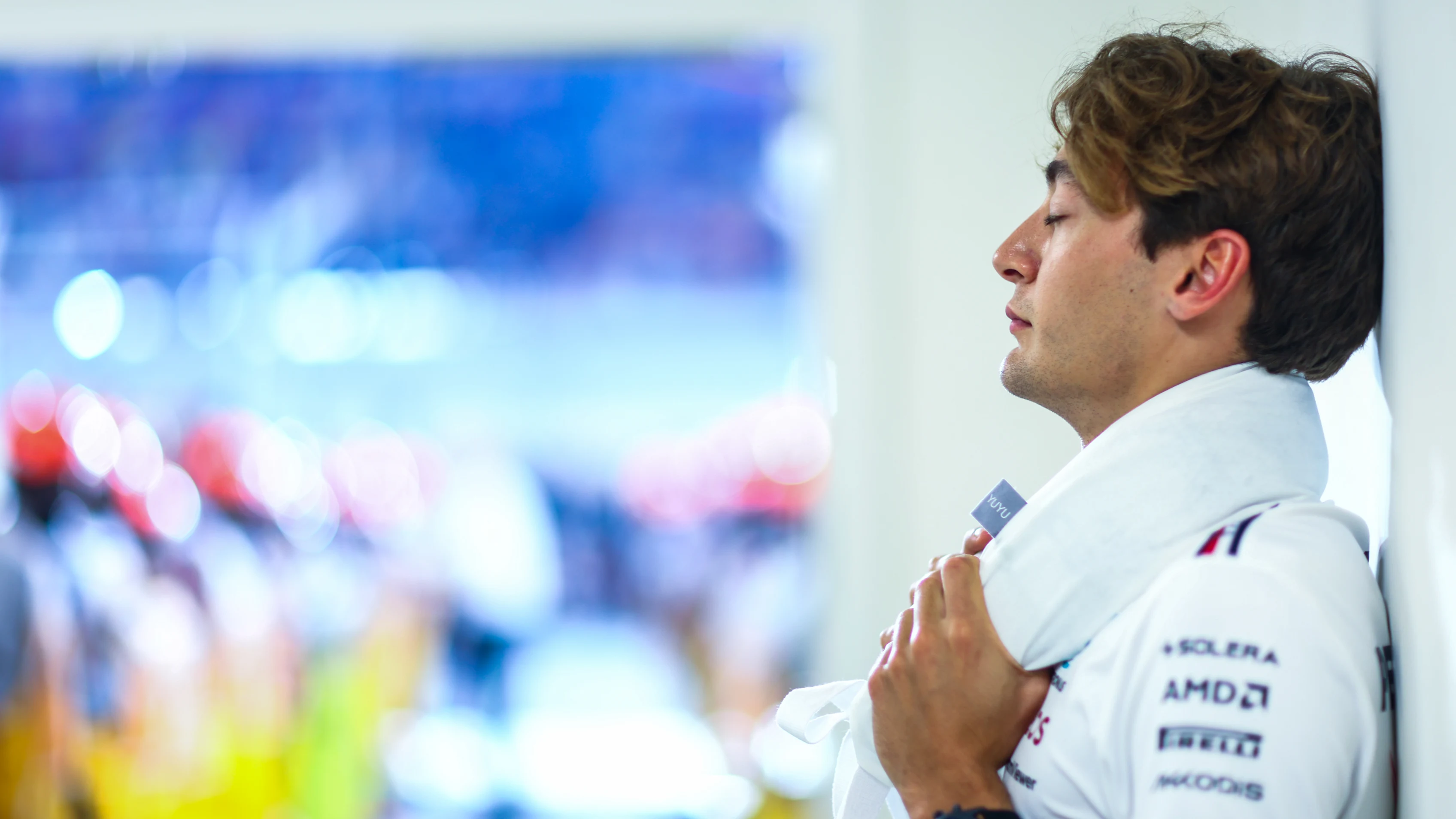LUSAIL CITY, QATAR - OCTOBER 08: George Russell of Great Britain and Mercedes looks on from the