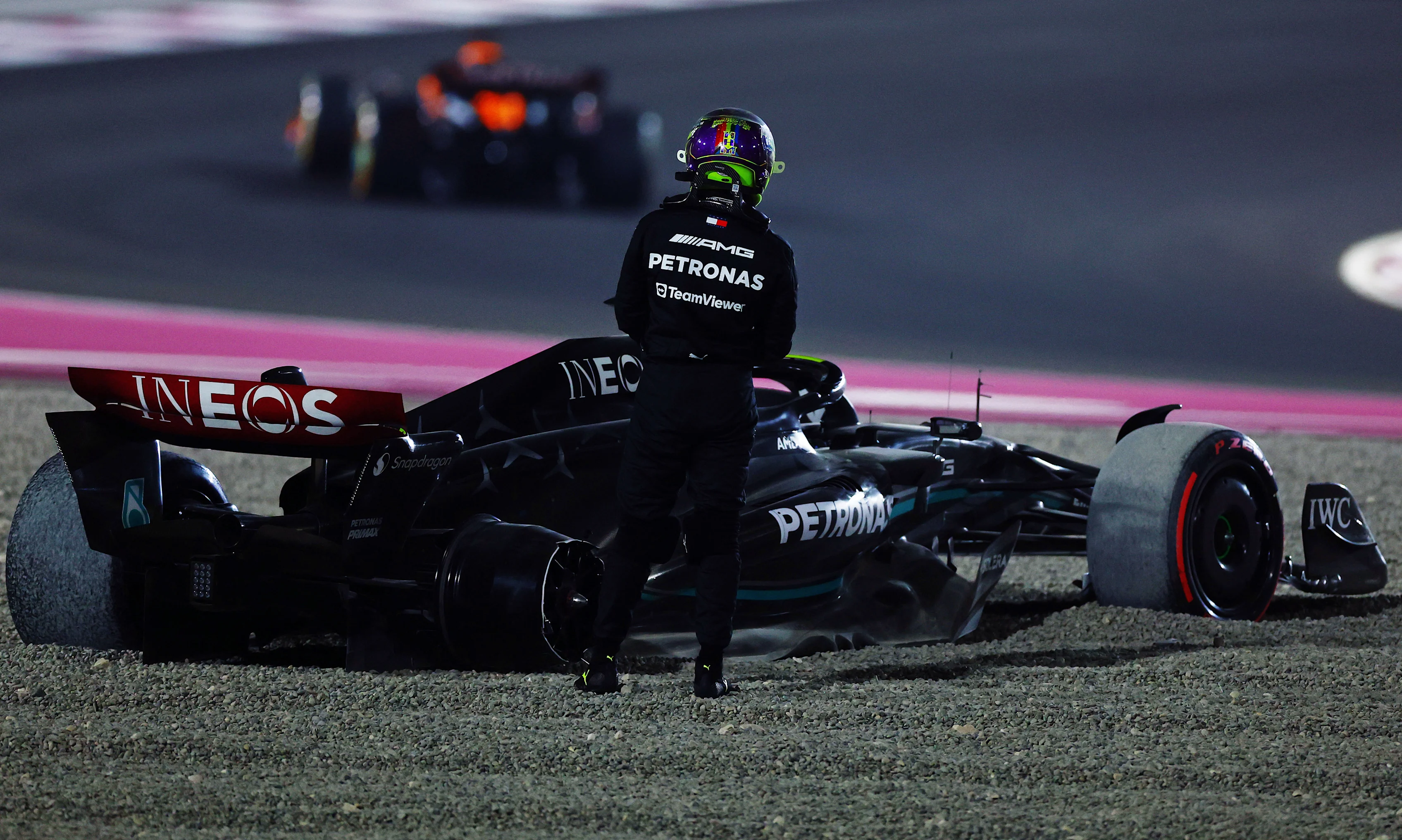 LUSAIL CITY, QATAR - OCTOBER 08: Lewis Hamilton of Great Britain and Mercedes looks on after retiring from the race during the F1 Grand Prix of Qatar at Lusail International Circuit on October 08, 2023 in Lusail City, Qatar. (Photo by Mark Thompson/Getty Images)
