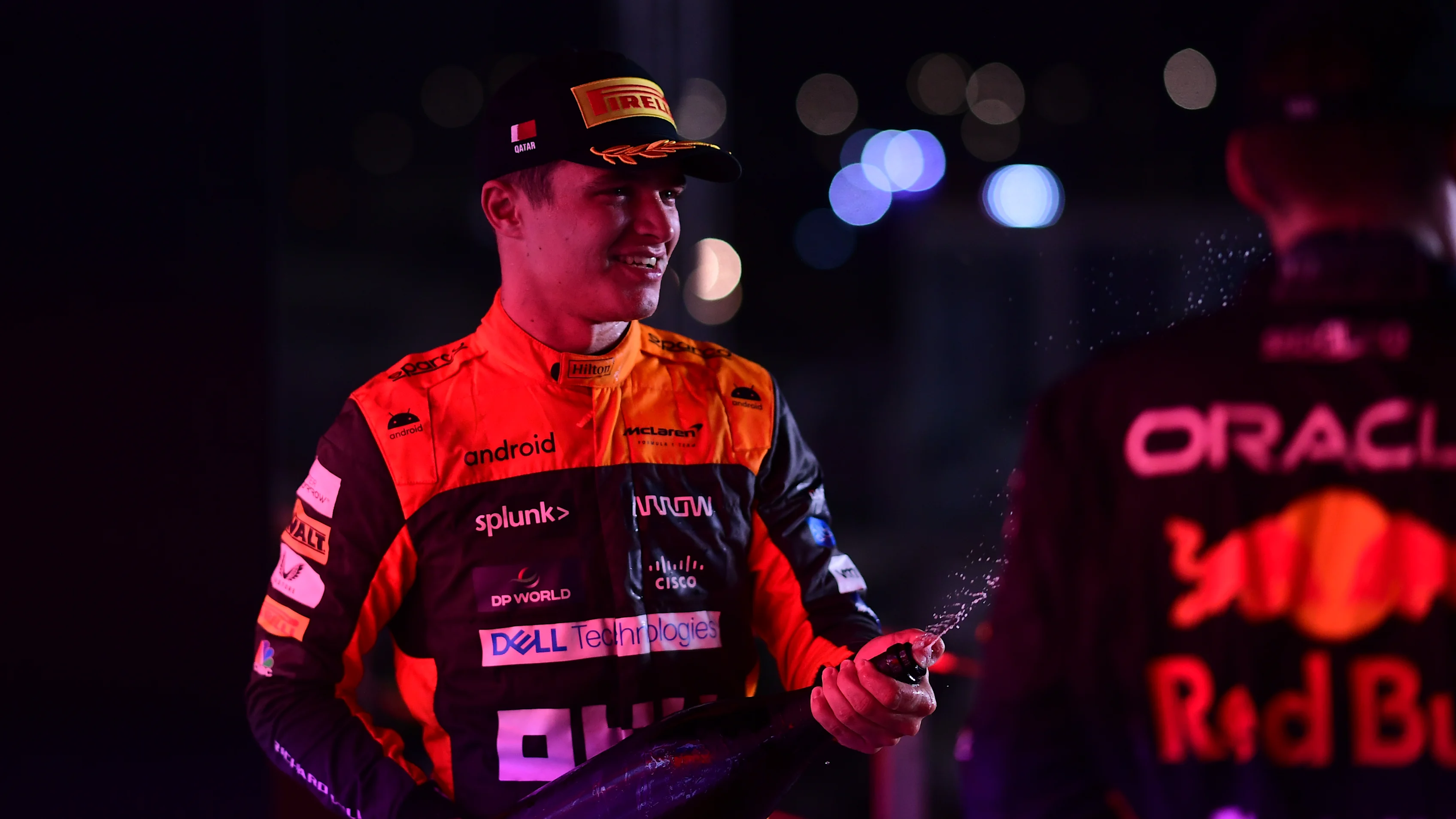 LUSAIL CITY, QATAR - OCTOBER 08: Third placed Lando Norris of Great Britain and McLaren celebrates