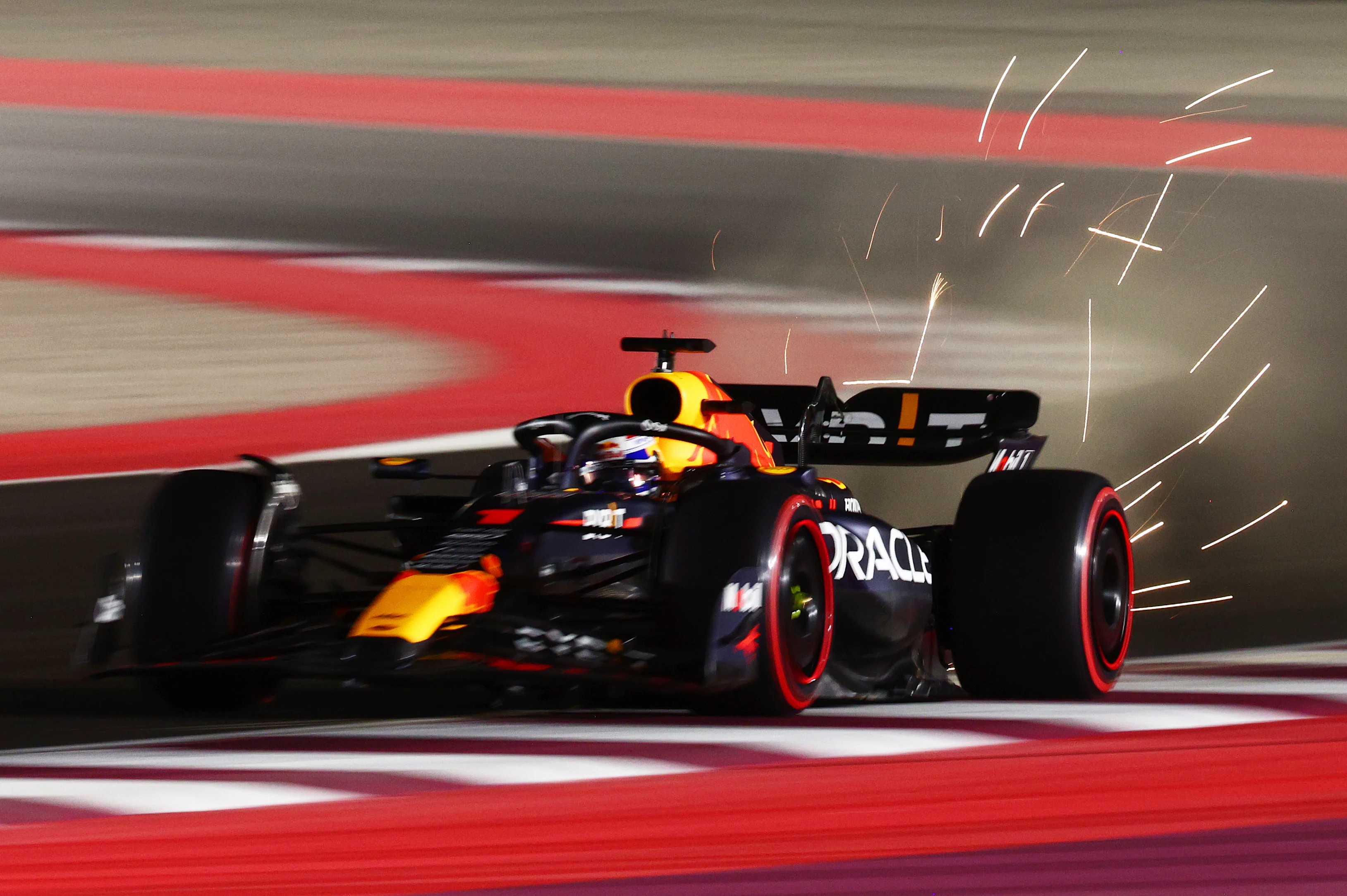 LUSAIL CITY, QATAR - OCTOBER 06: Sparks fly behind Max Verstappen of the Netherlands driving the (1) Oracle Red Bull Racing RB19 during qualifying ahead of the F1 Grand Prix of Qatar at Lusail International Circuit on October 06, 2023 in Lusail City, Qatar. (Photo by Clive Rose/Getty Images)