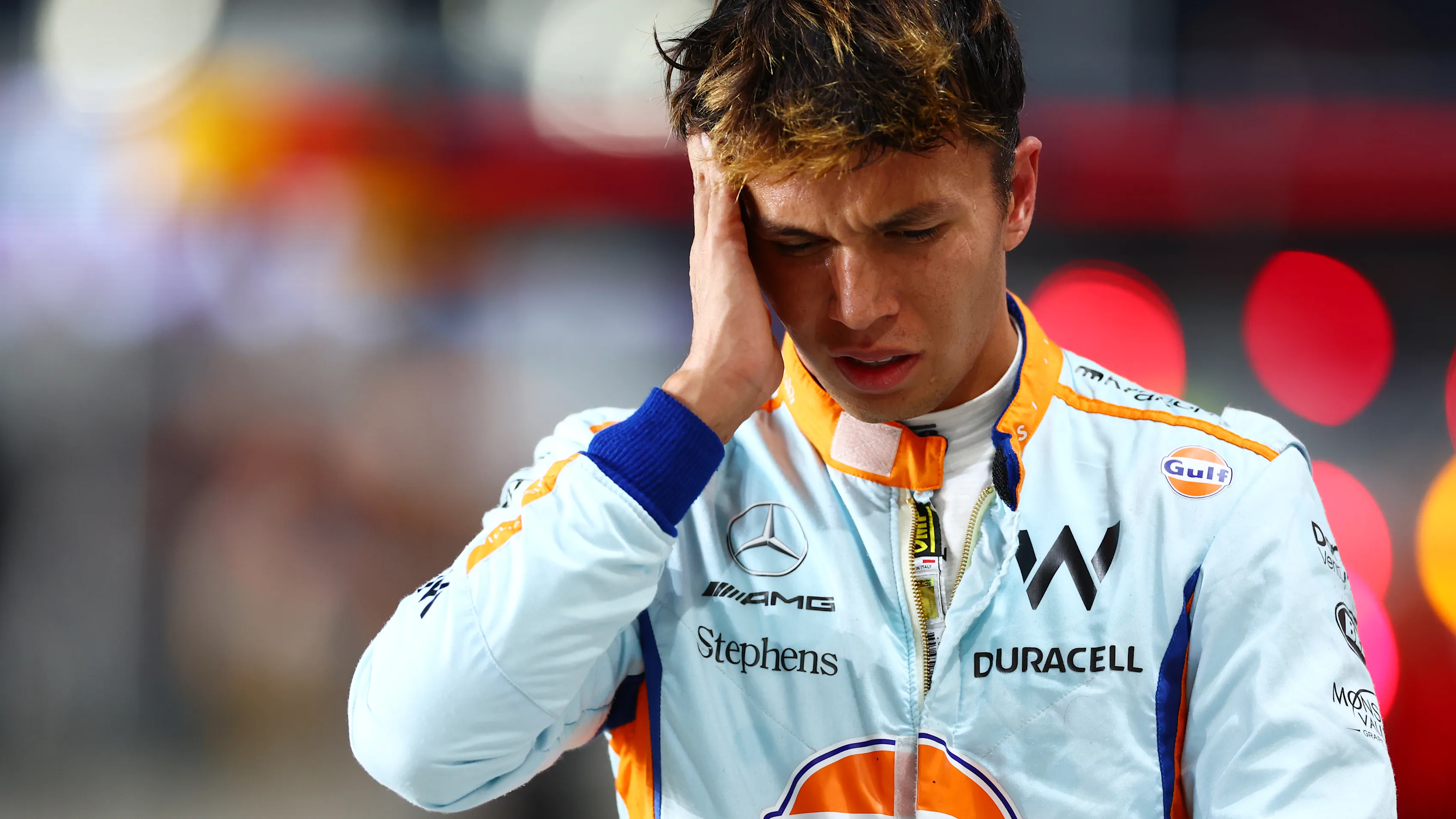 LUSAIL CITY, QATAR - OCTOBER 06: 14th placed qualifier Alexander Albon of Thailand and Williams walks in the Pitlane during qualifying ahead of the F1 Grand Prix of Qatar at Lusail International Circuit on October 06, 2023 in Lusail City, Qatar. (Photo by Dan Istitene - Formula 1/Formula 1 via Getty Images)