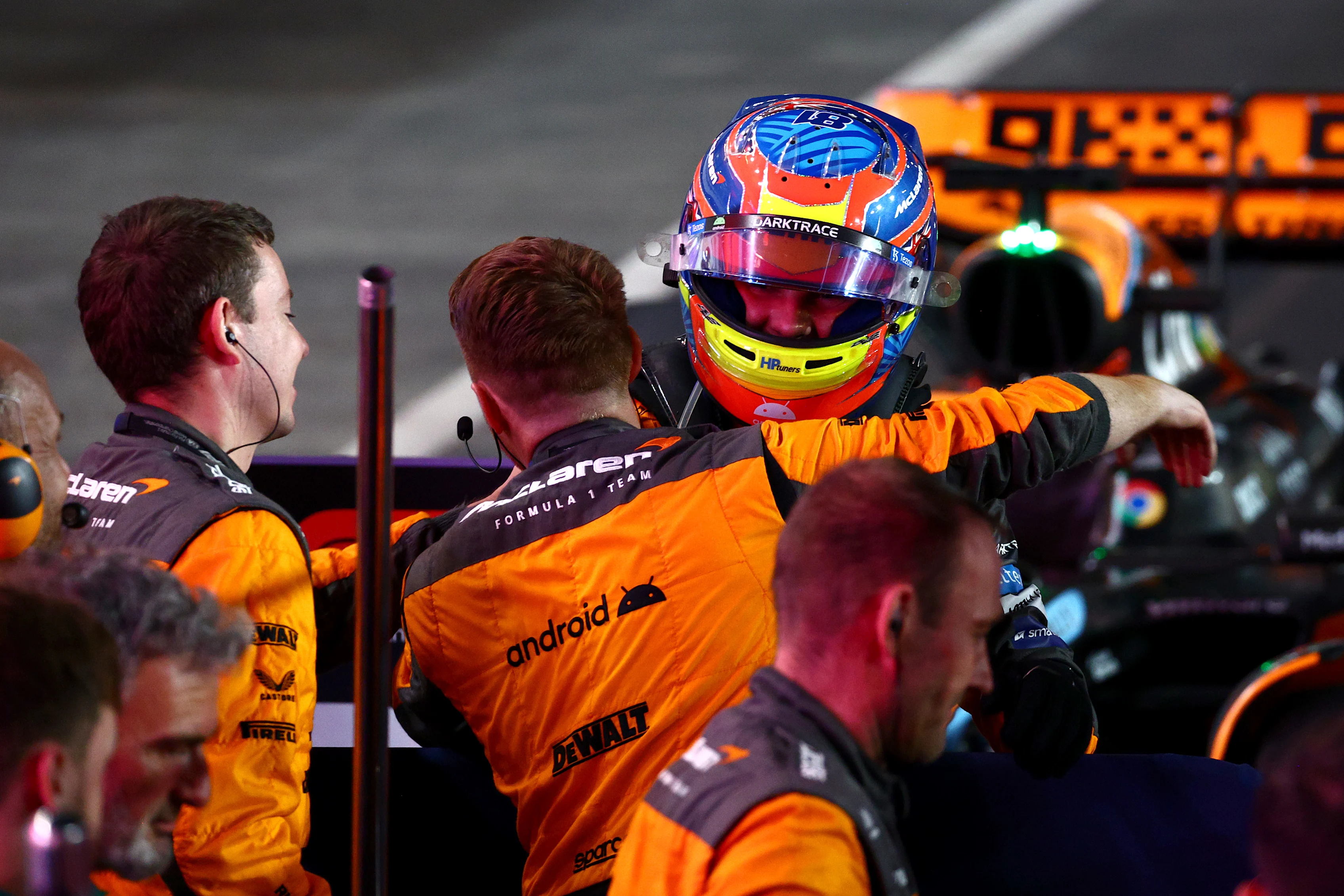 LUSAIL CITY, QATAR - OCTOBER 07: Sprint winner Oscar Piastri of Australia and McLaren celebrates with his team in parc ferme during the Sprint ahead of the F1 Grand Prix of Qatar at Lusail International Circuit on October 07, 2023 in Lusail City, Qatar. (Photo by Clive Rose/Getty Images)