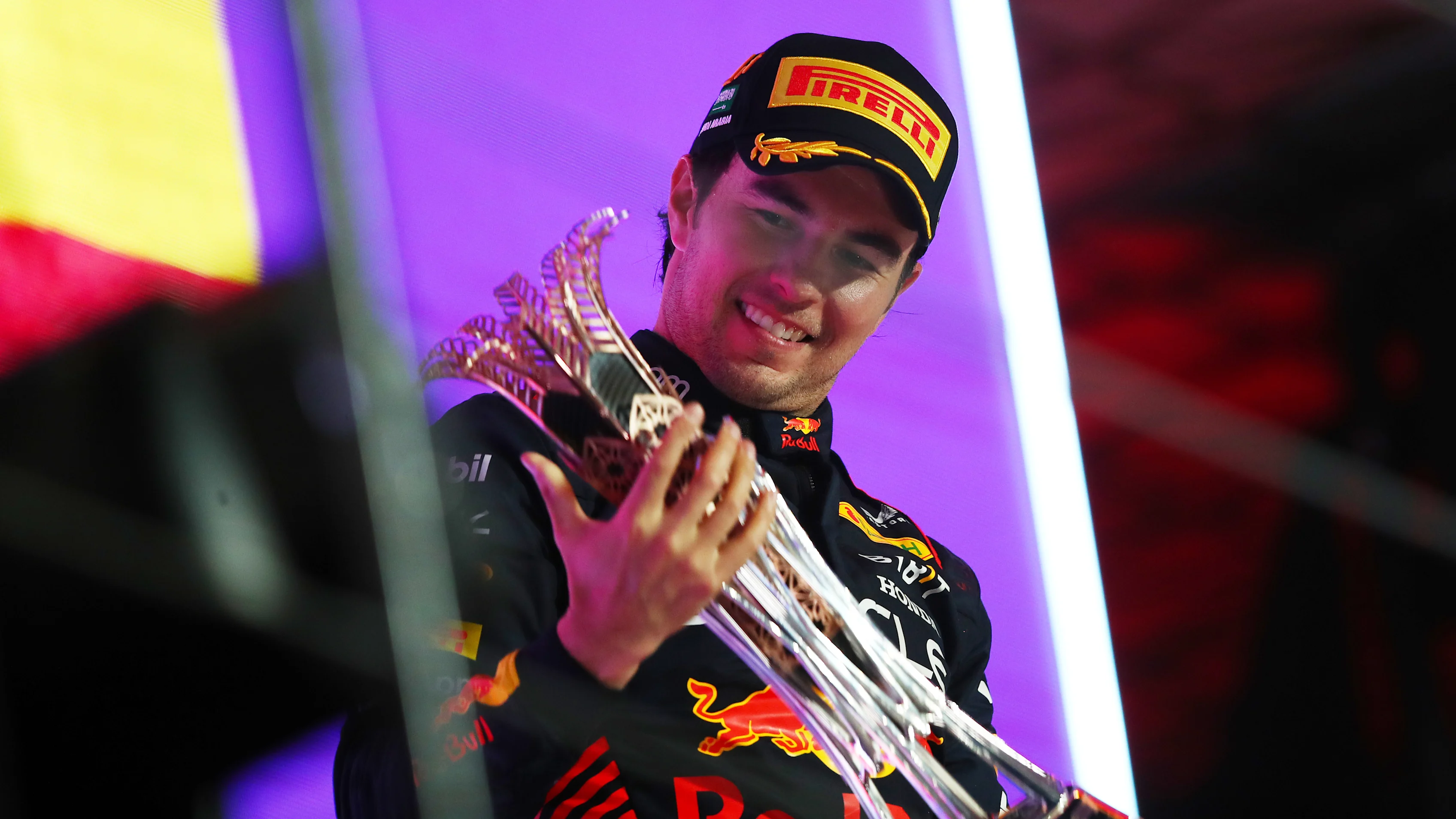 JEDDAH, SAUDI ARABIA - MARCH 19: Race winner Sergio Perez of Mexico and Oracle Red Bull Racing celebrates on the podium during the F1 Grand Prix of Saudi Arabia at Jeddah Corniche Circuit on March 19, 2023 in Jeddah, Saudi Arabia. (Photo by Joe Portlock - Formula 1/Formula 1 via Getty Images)