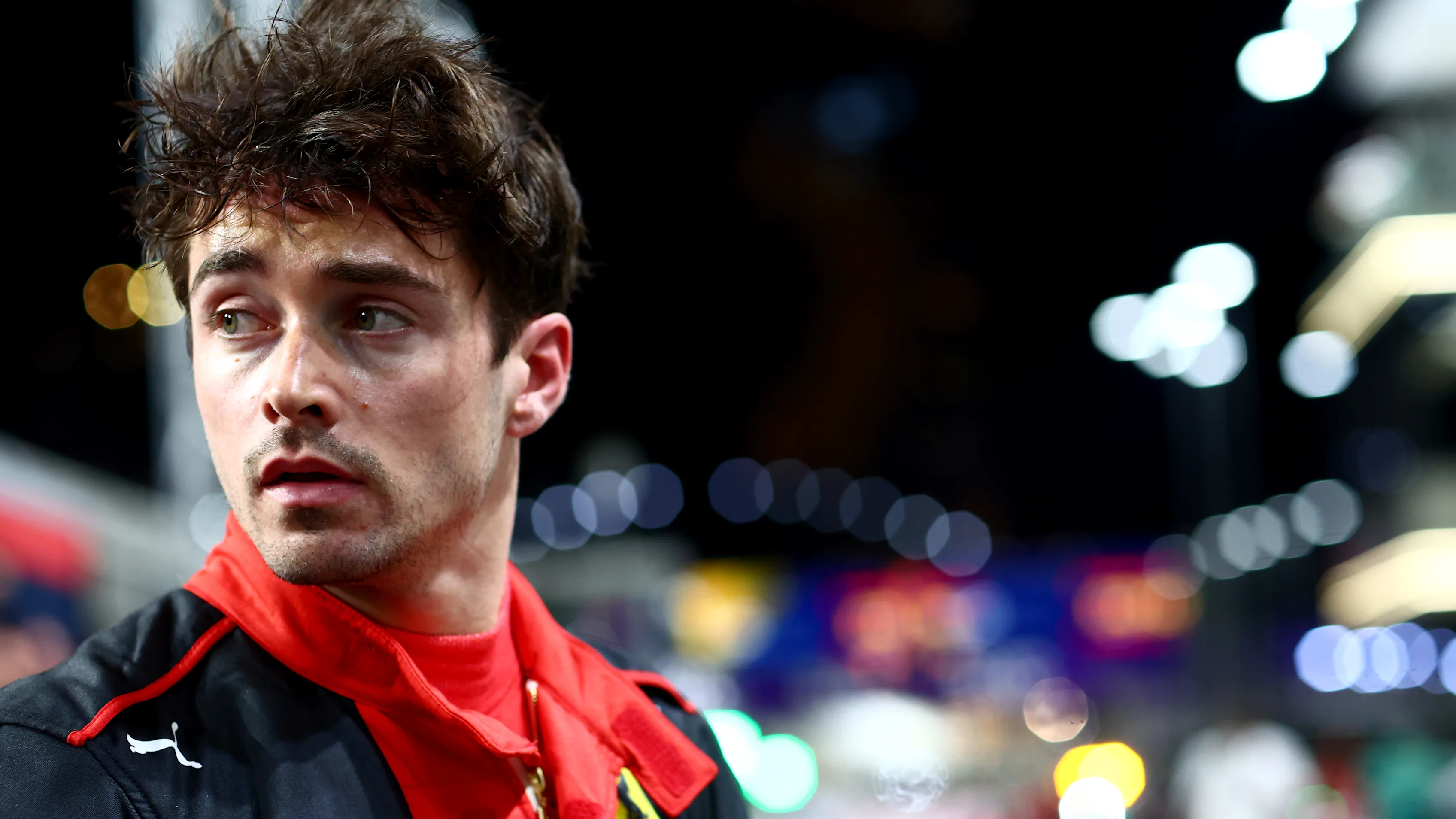 JEDDAH, SAUDI ARABIA - MARCH 18: Second placed qualifier Charles Leclerc of Monaco and Ferrari looks on in parc ferme during qualifying ahead of the F1 Grand Prix of Saudi Arabia at Jeddah Corniche Circuit on March 18, 2023 in Jeddah, Saudi Arabia. (Photo by Dan Istitene - Formula 1/Formula 1 via Getty Images)