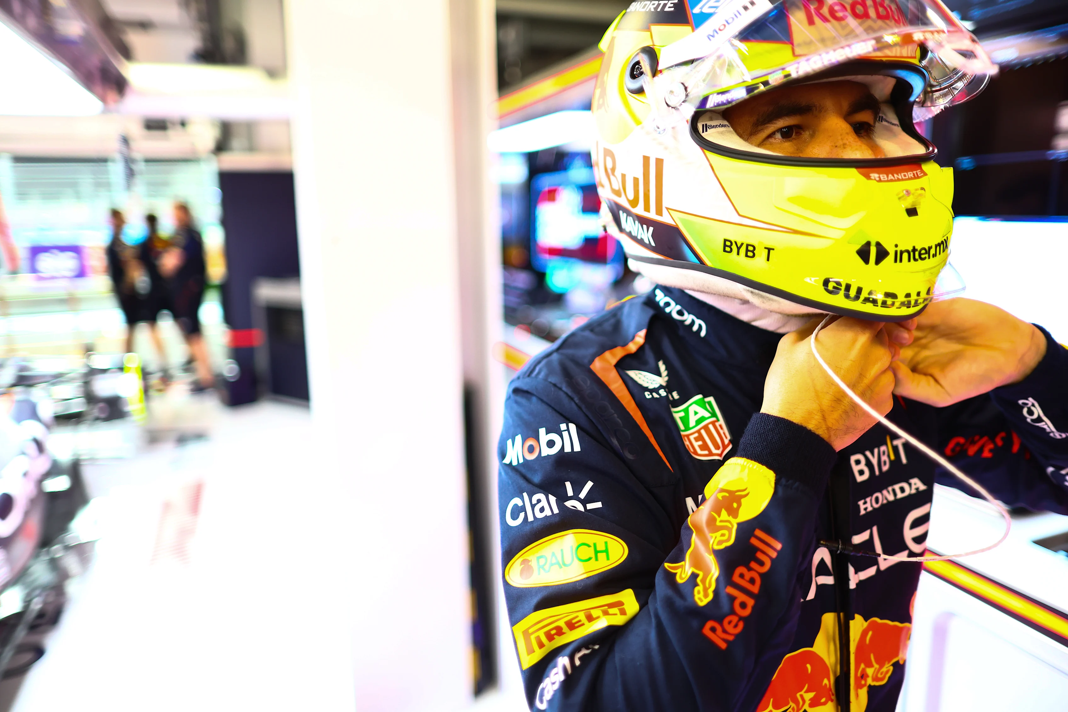JEDDAH, SAUDI ARABIA - MARCH 18: Sergio Perez of Mexico and Oracle Red Bull Racing prepares to drive in the garage during qualifying ahead of the F1 Grand Prix of Saudi Arabia at Jeddah Corniche Circuit on March 18, 2023 in Jeddah, Saudi Arabia. (Photo by Mark Thompson/Getty Images)