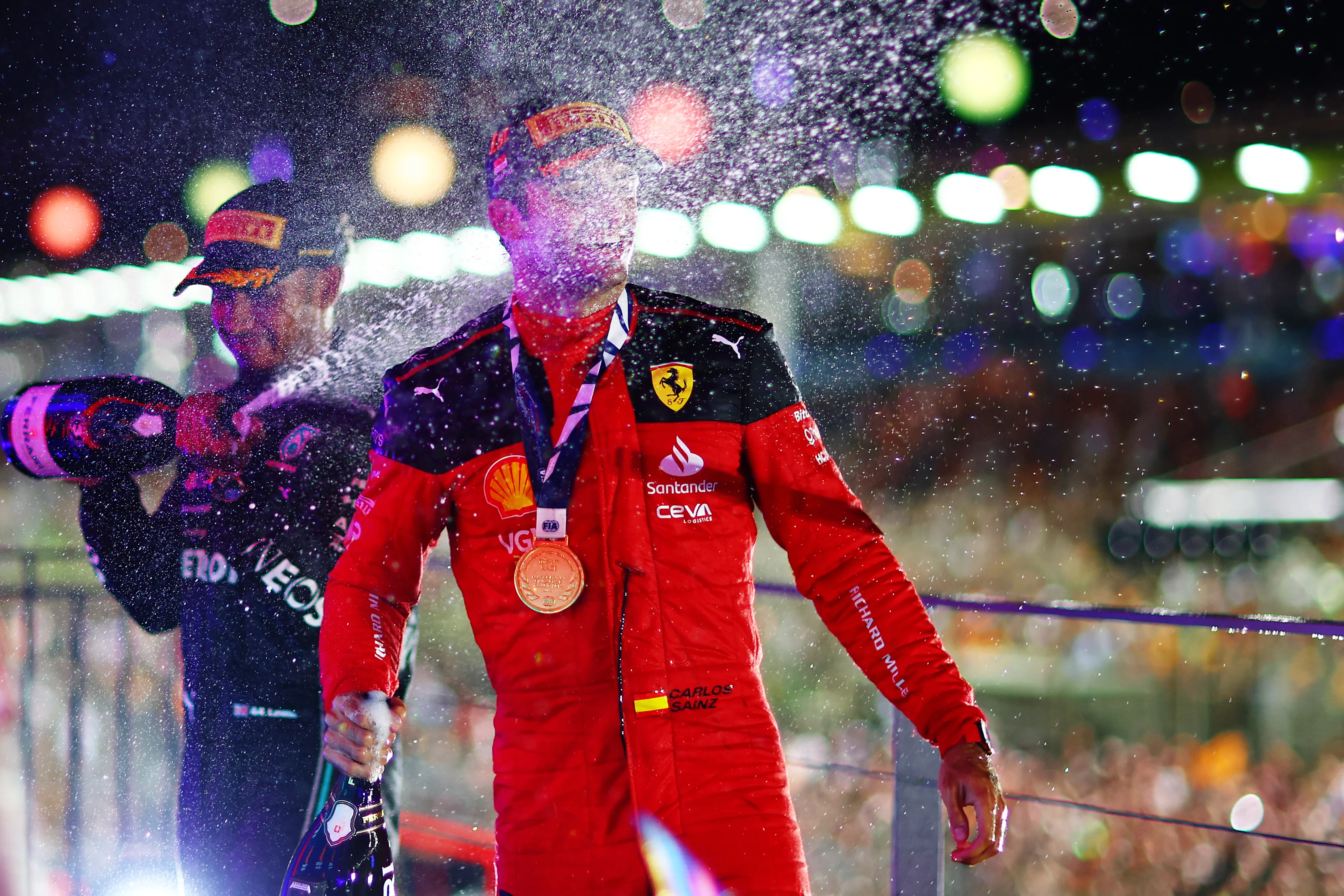 SINGAPORE, SINGAPORE - SEPTEMBER 17: Race winner Carlos Sainz of Spain and Ferrari celebrates with