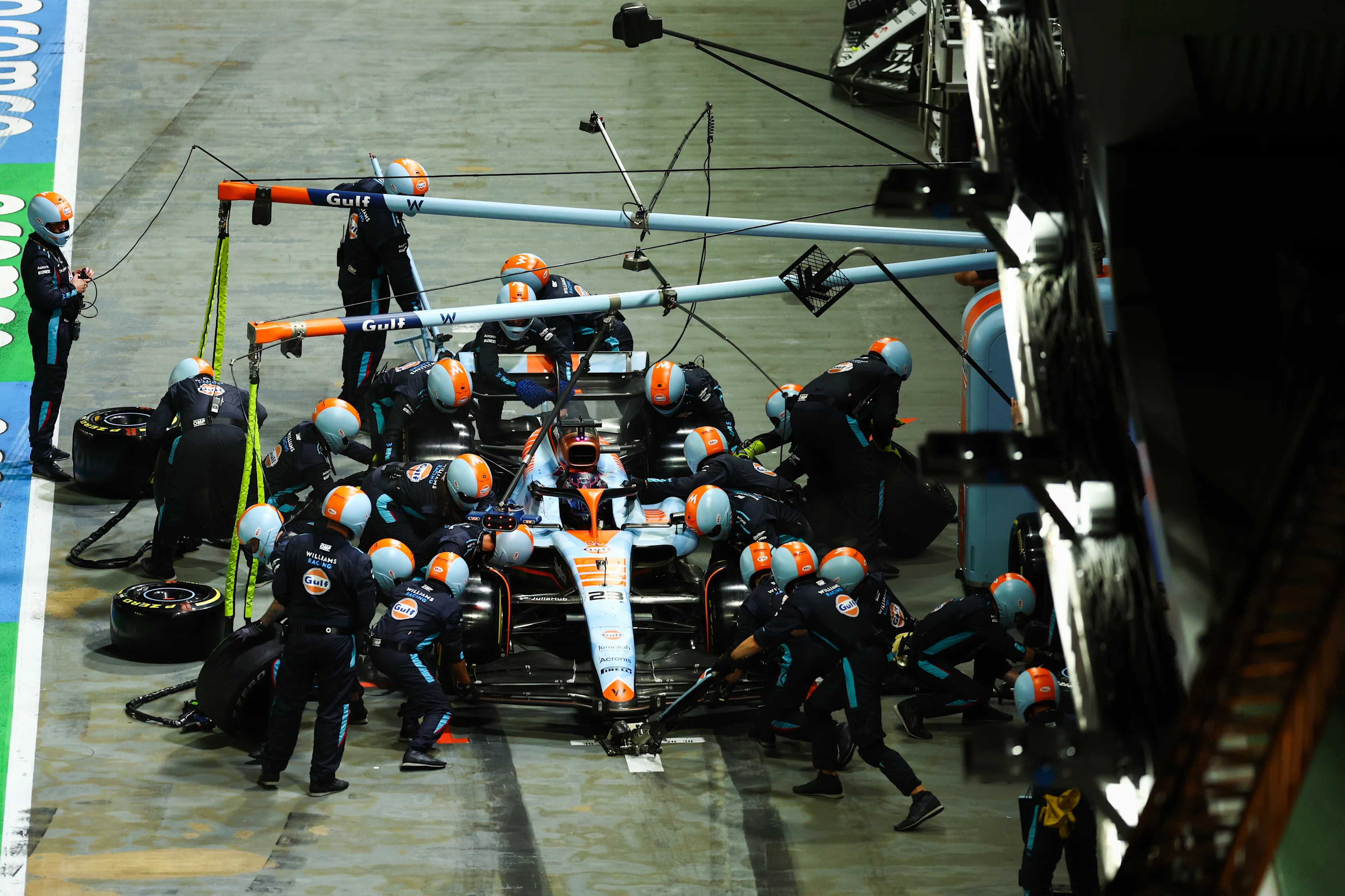 SINGAPORE, SINGAPORE - SEPTEMBER 17: Alexander Albon of Thailand driving the (23) Williams FW45 Mercedes makes a pitstop during the F1 Grand Prix of Singapore at Marina Bay Street Circuit on September 17, 2023 in Singapore, Singapore. (Photo by Bryn Lennon - Formula 1/Formula 1 via Getty Images)