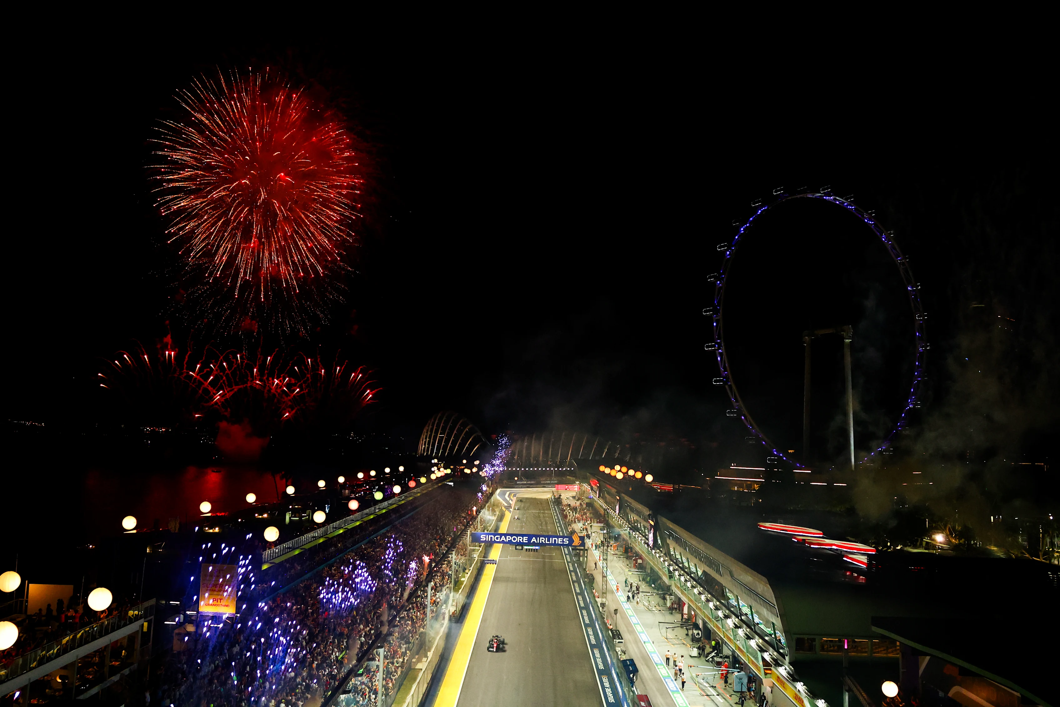 SINGAPORE, SINGAPORE - SEPTEMBER 17: Twelfth placed Zhou Guanyu of China driving the (24) Alfa