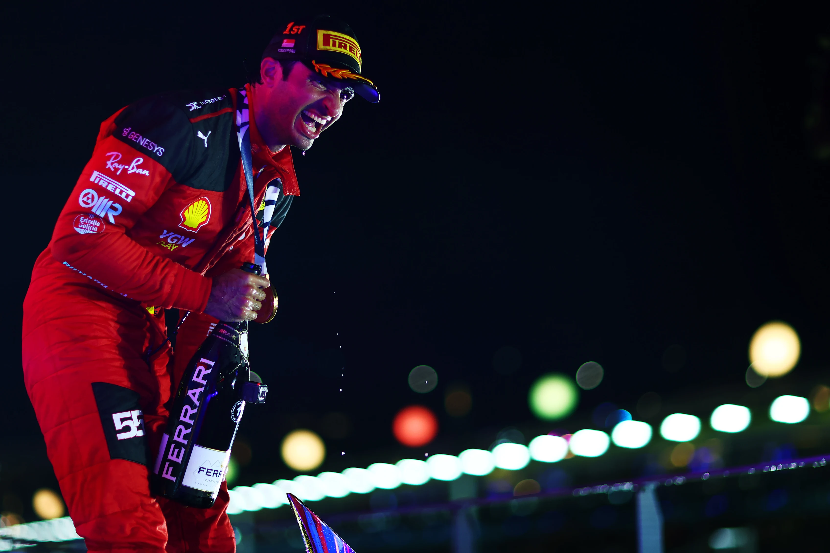 SINGAPORE, SINGAPORE - SEPTEMBER 17: Race winner Carlos Sainz of Spain and Ferrari celebrates on